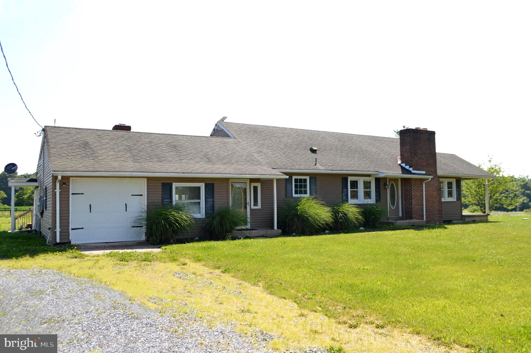 NEW IMPROVED PRICE! This charming 10.95-acre farmette offers three fenced, level pastures, each thoughtfully equipped with Nelson 700 Series automatic waterers (installed in 2023) and Flex fencing (installed in 2021 and 2022). Two of the pastures also include convenient run-in sheds.  The barn provides ample storage and is already set up with two stalls. Inside the home, you’re welcomed by a comfortable family room and a bright sunroom just off the kitchen. The kitchen features a farmhouse sink, granite countertops, and stainless steel appliances. A separate dining room, three bedrooms, and a primary suite with a private bath complete the layout.  Recent updates add even more peace of mind, including a new 10kW backup generator (2024) and a new HVAC system (2023).  Come take a look—you won’t want to miss it!