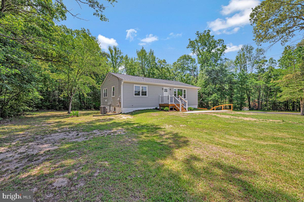 Nestled in the serene enclave of Brandywine, this updated and upgraded ranch-style home offers a blend of comfort and sophistication. With 3 spacious bedrooms , this residence is designed for both relaxation and entertaining, making it the perfect sanctuary for those who appreciate a quieter life. Step inside to discover an inviting open floor plan that seamlessly connects the dining and living areas, creating a warm atmosphere ideal for gatherings. The upgraded countertops in the kitchen not only enhance the aesthetic appeal but also provide a functional space for culinary creativity. Equipped with energy-efficient appliances, including a built-in microwave, self-cleaning oven, dishwasher, and refrigerator, this kitchen is a pleasure to cook in, combining style with practicality. The home features a thoughtfully designed entry-level bedroom, perfect for guests or as a private office space. Each bathroom is tastefully appointed. The fully finished daylight basement offers additional living space, ideal for a media room, gym, or play area, with convenient garage access for ease of use. Outside, the nearly one-acre lot is a true retreat, partly wooded and backing to lush trees, providing a sense of privacy and tranquility. Imagine sipping your morning coffee on the expansive deck, surrounded by nature's beauty, or hosting summer barbecues in this idyllic setting. The side-entry garage adds to the home's curb appeal while providing ample parking and storage. This property is not just a home; it's a lifestyle. Enjoy the peace of mind that comes with living in a well-established community, where nature and privacy coexist. With its prime location and high-end features, this residence is a rare find that promises a life of comfort, elegance, and convenience. Experience the perfect blend of indoor and outdoor living in this stunning Brandywine gem.