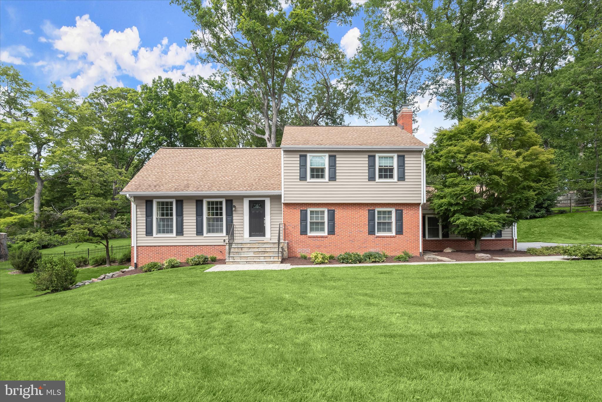 Stunning home in sought-after Ancient Oak community, beautifully updated and meticulously maintained throughout. Recent improvements include a stunning kitchen renovation, new siding and gutters, and a remodeled powder room in 2021, along with a luxurious primary suite renovation in 2025 and numerous additional updates.  Step inside to a sun-filled, inviting floor plan beginning with a spacious living room showcasing hardwood floors and elegant accent molding. The beautifully renovated kitchen is the centerpiece of the home, featuring a peninsula breakfast bar, center island, quartz countertops, stainless steel appliances, striking herringbone tile backsplash, and a generous dining area perfect for everyday living and entertaining. Just a few steps down, the welcoming family room offers a cozy fireplace with a classic brick surround and a custom coffee bar, creating the perfect gathering space. Sliding glass doors lead to a spacious sunroom highlighted by a dramatic wood shiplap cathedral ceiling with skylights and direct access to the backyard. The lower level provides abundant storage and flexible space, perfect for a home gym or customized to suit your exact needs.  Upstairs, three generously sized bedrooms feature hardwood flooring and ceiling fans, complemented by a well-appointed hall bath. The private top-level primary suite is a true retreat, boasting skylights, a walk-in closet, and a beautifully renovated en-suite bath with a granite-topped vanity and glass-enclosed shower.  Outdoor living shines on the expansive patio overlooking extensive hardscaping and a fully fenced backyard. Situated on a premium lot backing to mature trees, this serene setting offers privacy and beautiful natural views year-round.  Ideally located near major commuter routes, shopping, dining, parks, and entertainment, this exceptional home combines stylish updates, flexible living spaces, and an unbeatable location in one of the area's most desirable communities.