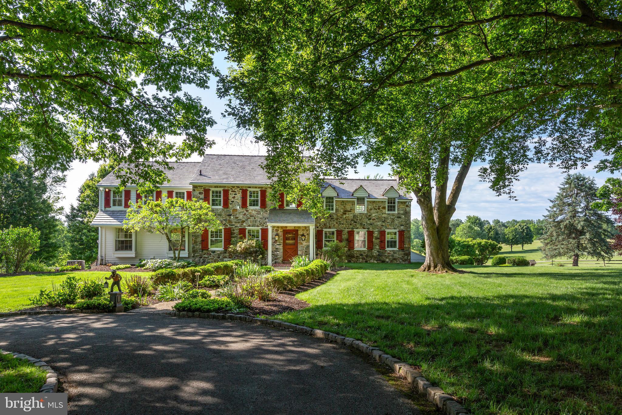 Welcome to Glendalough, a truly special “gentleman’s farm” where peace, privacy, and nature converge. Accessed via a long, private driveway, this 18-acre estate is a haven for outdoorsmen, nature lovers, and those seeking a quiet rural retreat. Protected by the Willistown Conservancy Trust and featuring two serene ponds, the grounds offer a landscape defined by natural light and memorable sunsets.
This stone colonial has been lovingly maintained, showcasing a classic stone exterior and a cedar roof, all framed by mature, lush landscaping. Inside, you’ll find a home of understated elegance.
MAIN LEVEL
A gracious foyer leads to fireside living with a large picture window framing pastoral views. The formal dining room features charming built-ins, flowing into a large, updated kitchen and a generous breakfast room. The family room addition is striking, boasting high ceilings, a stone fireplace, and expansive windows that offer what may be the most spectacular views in Willistown Township. Multiple doors lead to a patio and deck overlooking the pool and remarkable views.
SECOND LEVEL
Features five spacious bedrooms and four baths. The primary suite is a private retreat with its own fireplace, ample closet space, and attached bath. The additional bedrooms offer a flexible layout, perfect for family or guests.

ART STUDIO
Creative spirits will be inspired by the separate, dedicated art studio, boasting high ceilings, a basement, fireplace, and full bathroom. Bathed in natural light and tucked away from the main house, it provides the perfect quietude for any artistic pursuit. Or, with all its amenities, this could be easily converted into a guest home!

Nestled within the rolling, protected landscapes of Willistown Township, this special property represents the pinnacle of the Chester County “gentleman’s farm.” This is a property designed for those who seek the quiet dignity of a rural retreat without sacrificing the refinements of modern life. It is where the rhythmic pace of the seasons meets the sophisticated pulse of the Main Line.
Glendalough is more than a residence; it is a legacy. It is a rare opportunity to own a piece of Willistown’s rural splendor that balances the heritage of the past with the luxury of the present.
Life at Glendalough is defined by its serene, pastoral character. As a hobby farm, the property offers more than just acreage; it offers a lifestyle of curated agricultural hobbyism. Whether your passion is equestrian pursuits, artisanal gardening, or simply the stewardship of historic Pennsylvania land, Glendalough provides the infrastructure and the atmosphere to indulge those desires.

Located within minutes of the prestigious Radnor Hunt Club, the estate is situated in the heart of horse country, where a network of trails and a deep-seated tradition of fox hunting and trail riding still thrive.
While the setting feels worlds away from the city, Glendalough is “conveniently located” in every sense. It offers a rare paradox: the ability to check on your pastures in the morning and be in a boardroom or a world-class restaurant by noon.
Minutes from regional rail and Amtrak service, providing a seamless commute to Philadelphia or New York. For international travel, Philadelphia International Airport is easily accessible.
Ideal for the equestrian, the property includes a 6-stall barn with a tack room and a wash room. The second floor features a bright, rustic loft with potential for conversion into a small guest apartment or staff quarters.