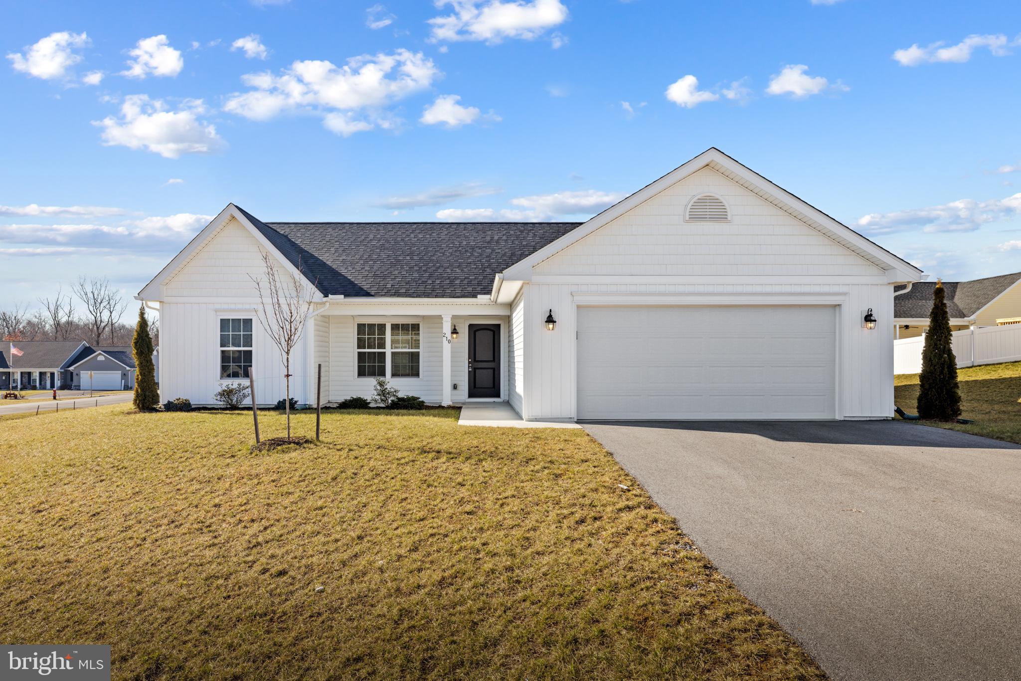 Are you dreaming of a new home but don't want to wait for it to be built? This is the perfect solution! This 4-year-old rambler home in the desired Bridle Creek subdivision offers a fantastic floor plan, with bedrooms on the opposite sides of the home, offering you more privacy. The spacious living room has cathedral ceilings and is open to the gorgeous kitchen, with granite counters, SS appliances, and subway tile backsplash. A center island offers additional seating, and there is also a pantry for all of your storage needs. The relaxing primary bedroom has a sizeable walk-in closet and an attached bathroom with a dual vanity. The other two bedrooms on the other side of the house share a hall bathroom. There is plenty of outdoor space here, with two covered porches to enjoy your morning coffee or relax in the evening. You can also enjoy all the amenities that Bridle Creek offers, such as a tot lot, basketball court, walking trails, a pavilion for gatherings, and more. All of this, plus a convenient location with easy access to I-81, downtown Martinsburg, and the MARC train station, offers easy commuting.
