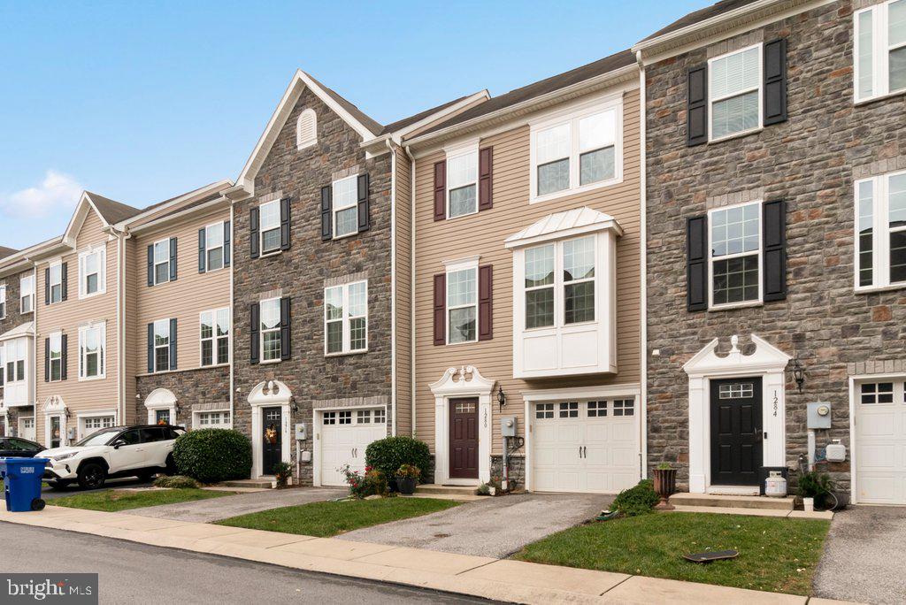 Discover the perfect blend of comfort and convenience in this stunning interior unit townhome located in a sought-after gated community with private golf course access and a sparkling pool. This 3-bedroom, 2-bath gem boasts a 1-car garage and driveway, offering ample parking. The open-concept kitchen features a spacious island and a walk-in pantry, making meal prep and storage a breeze. Sliding glass doors lead to a large Trex deck, perfect for entertaining or relaxing while enjoying serene views of the green space. For added convenience, the laundry room is thoughtfully located on the top floor. Experience low-maintenance living with all the amenities you’ve been dreaming of!