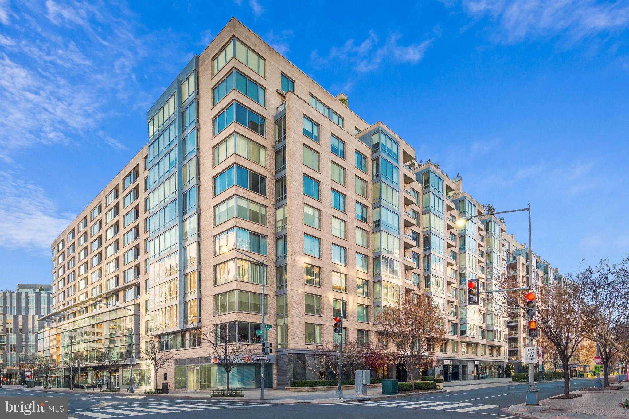 Welcome to The Ritz-Carlton Residences unit 6E. This stunning 3 bedroom, 3.5 bath, 3,000+ SF condo offers elegant living and bespoke finishes in the heart of the West End. Upon entering, the open concept living and dining rooms feature floor to ceiling windows, automated shades, and hardwood floors, plus access to the terrace. The adjacent chef’s kitchen is outfitted with custom cabinetry and top-of-the-line appliances which makes it equipped for hosting events large and small. The spacious primary suite is well-appointed with  ample closet space and a luxurious spa-like bathroom. Down the hall, a generously sized second bedroom with ensuite bath is accompanied by a third bedroom and guest bath. Two parking spaces completes this exceptional offering. Enjoy all the white glove services of the legendary Ritz-Carlton, including 24-hour concierge, doormen, porters, valet parking, security, and more. The West End location provide an abundance of conveniences with numerous top restaurants, health clubs, grocery stores and is within easy distance to Georgetown and the Kennedy Center.