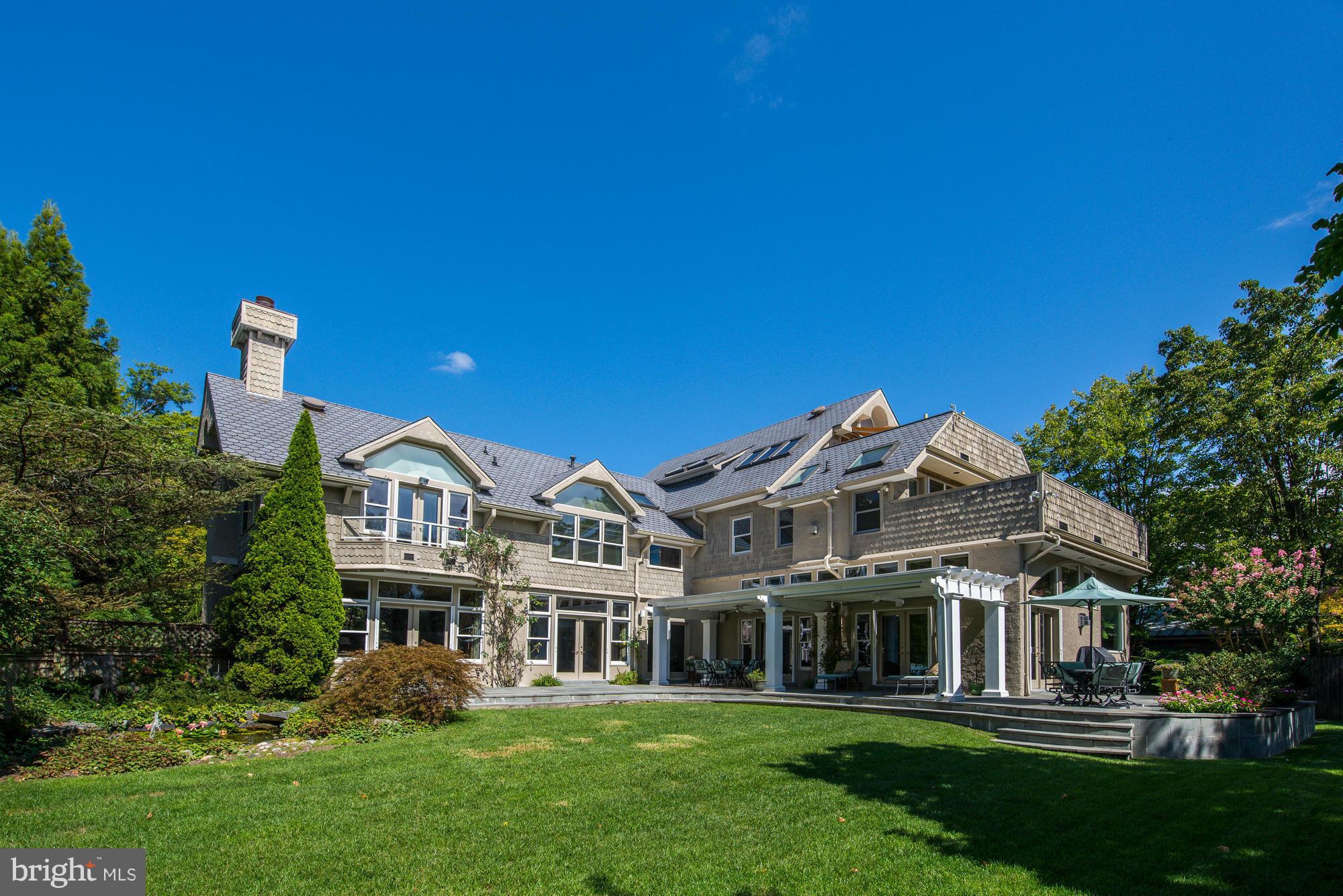 $100,000 price reduction!   Must see this spectacular home with soaring ceilings, private corner lot, new kitchen, in-law suite, wine cellar, oversized heated 2 car garage, and the most beautiful natural light I've ever seen.  Less than 2 blocks to Metro & near Edgemoor Club!