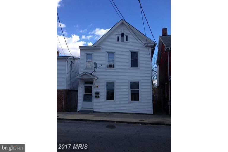 HOME OWNERSHIP OR INVESTMENT!!! One unit currently rented...1st floor has two bedrooms with full bath, storage/laundry and lg family room. Second unit has 2 bedrooms w/HW Floors, full bath, Kitchen/Dining and Family Room. Lot backs up to alley for access with covered car port. Easy commuter location...minutes from train station.