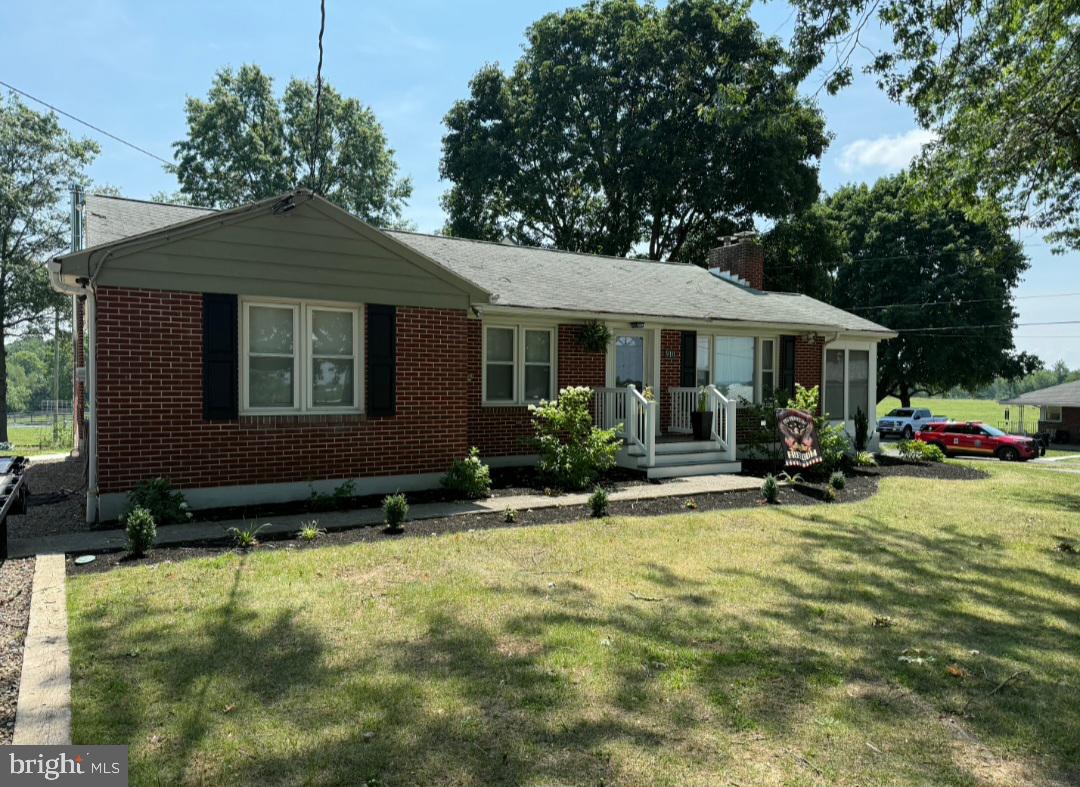 Welcome Home to this well maintained, 3-bedroom, all-brick home situated on .60 acres. Lots of updates throughout the home including flooring. Remote accessed, 2 car detached oversized garage is fully finished. This home has many updates throughout and is ready for new ownership! Kitchen has updated countertops and hardware, cooktop stove, built in microwave, dishwasher, sink recently replaced, formal dining and spacious living room with woodstove. If you are looking for more room, you will find a sunroom (not heated) located off from living room. Bathroom consists of a walk-in stall shower, recently replaced vanity.  Three hall entered bedrooms with closets. Lower level; partially finished basement with a bar to entertain guests. Laundry area is also located in basement. Outside from the sunroom you will find a spacious patio and yard with plenty of room for entertaining guests while grilling during summer months. 
More Photos to come.  Call me to schedule your showing today!
