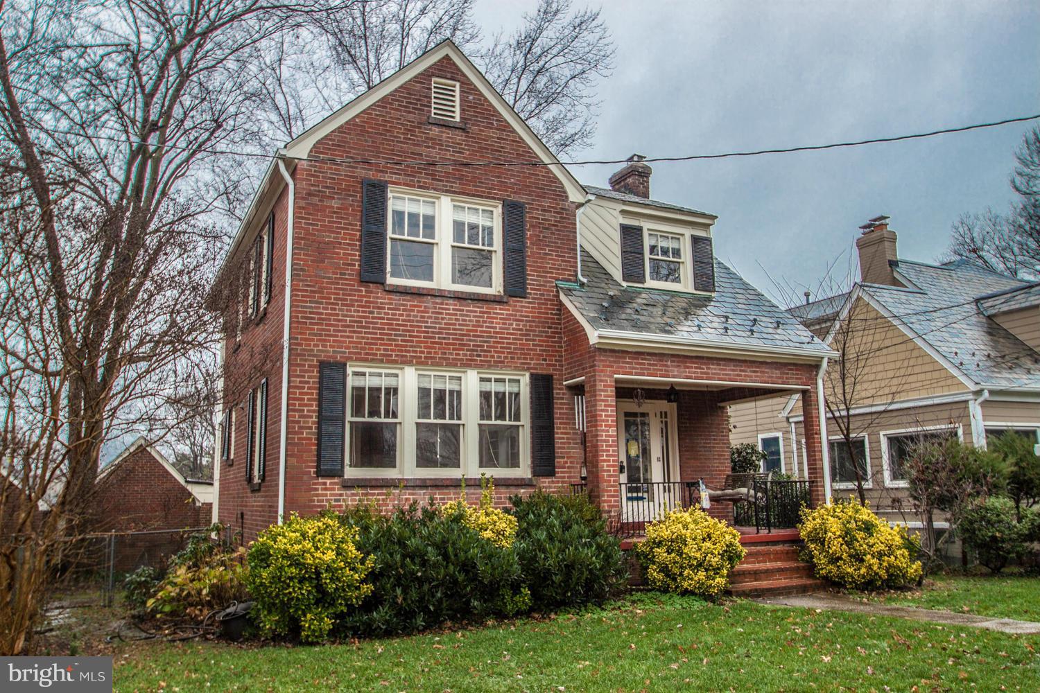 Great charm, expanded colonial with front porch, detached garage, carport & alley access. Professional painted throughout and all hardwood floors just refinished.  Rear 2-story addition provides for a family rm, larger kitchen & master bedroom expansion.  Cozy LR fireplace, finished lower level, main floor powder rm.  Only a few blocks to the King Street Metro. Fenced backyard.