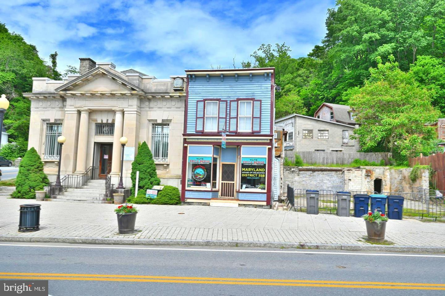 8 S Main Street, Port Deposit, MD 21904 — Mixed-Use Commercial/Residential Own your storefront and let the upstairs help pay for it. This rare mixed-use opportunity in the heart of historic Port Deposit puts you at one of the most visible intersections in town — directly across from the Post Office and Lee's Landing, right where Main Street traffic comes to a stop. Every car that rolls through town passes your front door. The approximately 750 sq ft commercial storefront features an open layout ready for your vision. This address has a storied history — once home to the town pharmacy, an ice cream shop, and a variety of businesses over the years — and it's waiting for its next chapter. Whether you're looking to open a boutique, café, office, or service business, the bones and the location are already working in your favor. Upstairs, a spacious 1-bedroom apartment is occupied by a long-term tenant currently under lease through August 2027 at $980/month — providing immediate, reliable rental income from day one. Whether you're an owner-operator or an investor, that steady cash flow helps offset your carrying costs right out of the gate. Port Deposit is a charming Susquehanna riverfront community with a tight-knit local vibe and a growing footprint of shops, restaurants, boat ramps, and fishing access — all within walking distance. This is a community on the rise, and this address sits right at its center. Stop paying someone else's mortgage. Own your space, grow your business, and collect rent while you do it.