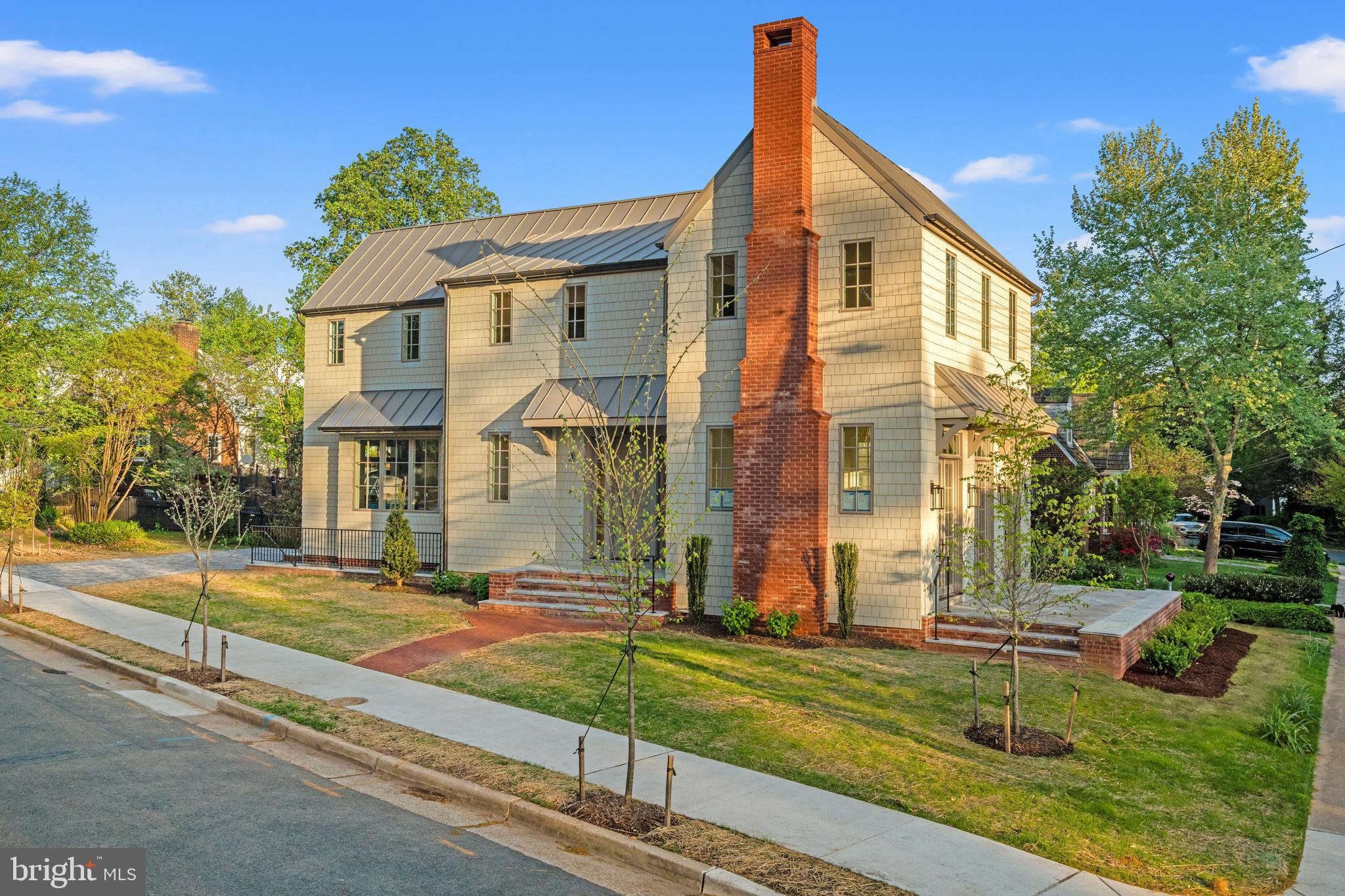 Some homes are built. Others are composed. Welcome to 1004 Virginia Ave—where every finish, fixture, and square inch feels intentionally elevated and effortlessly luxurious.
Perfectly positioned on a coveted corner lot in one of Alexandria City’s most beloved neighborhoods of Braddock Heights, this newly constructed residence makes an unforgettable first impression. Step inside to a welcoming foyer adorned with intricate basketweave hardwood floors—a subtle nod to the craftsmanship that unfolds throughout.
The main level is equal parts sophisticated and inviting, with soaring 10-foot ceilings and a seamless flow designed for both everyday living and exceptional entertaining. The kitchen is a true showpiece! Custom inset cabinetry sets the tone, while a statement island anchors the space with quiet confidence. Paneled GE Monogram appliances, including an induction range, blend seamlessly into the design, and a beautifully appointed scullery, complete with a second sink and matching inset cabinetry.
Upstairs, three beautifully appointed bedrooms offer walk-in closets with customizable Elfa systems, and en-suite baths, creating private retreats for everyone. The primary suite feels like a quiet exhale—vaulted ceilings, a charming bay window, and a versatile flex space perfect for a home office, upper-level laundry, or an enviable dressing room. The spa-inspired bath features double vanities, warm brass finishes, and a separate water closet.
The lower level delivers on both function and fun, with a spacious rec room, wet bar, and a generous fourth bedroom with a full bath—ideal for guests or extended stays. An additional laundry room and abundant storage ensure practicality never takes a back seat to style.
And then there are the finishes—the kind that quietly set this home apart. A metal roof and classic shaker siding create a timeless exterior, while a premium Marvin Windows package and curated Visual Comfort lighting elevate every detail. An electric car charger, dual heat pumps, and an energy recovery ventilator deliver comfort with efficiency, while discreet solar panels power a fully electric home. Forward-thinking, effortlessly executed.
Outside, the corner lot truly shines. A beautifully landscaped side yard sets the tone for everything from slow mornings to lively garden gatherings, while a cobble paver driveway and marble landings offer a subtle nod to luxury. The marble patio ties it all together—an effortlessly chic setting for al fresco dinners that linger a little longer
But perhaps the most special feature? The lifestyle. Here, neighbors become friends, block parties turn into traditions, and holiday carolers still make their rounds. Because at 1004 Virginia Ave, you’re not just buying a home—you’re stepping into a story. And trust me, it’s a good one.
