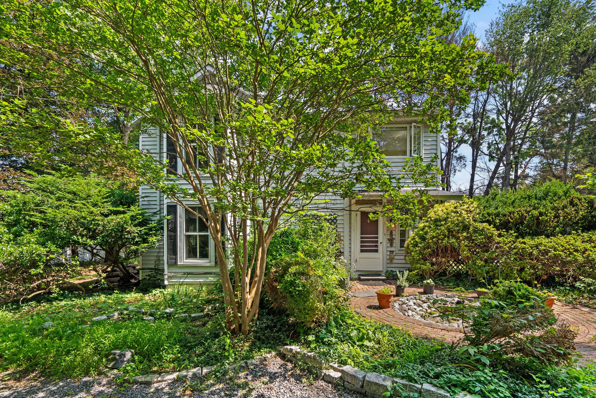 Welcome to this bright and airy 4 bedroom, 2.5 bath Potomac home that has the charm of 1890 (built as part of the Mt. Prospect Estate), but also all of the  modern amenities, including the 2 story addition.  As you drive in to the idyllic property, you are instantly calmed by the privacy it provides with its sprawling 1 acre lawn and 100+ year old specimen trees.   The entry of the house welcomes your guests into the charming foyer complete with a bay window, built ins, and a shiplap ceiling.  Next you will enter the spacious pine-paneled dining room, which has built in storage, brick detail, and decorative beams.  The living room has original wood floors, a wood-burning stove, and double doors that open up to another living space with floor to ceiling windows.  The main level also includes an updated kitchen with large island and 3 closets, a half bath, and a kitchenette in the addition.  Upstairs is the primary bedroom suite which has its own staircase off the kitchen, and includes a huge full bath with soaking tub, standing shower, and plenty of storage, a walk in closet, and spacious bedroom area.  The upper level also includes 3 other bedrooms, including a bedroom with an attached office/studio and a pine-paneled room with built ins, a laundry room and a full bath with skylight.  The house includes many original charming details such as door locks with key. Don't miss your chance to own a piece of Montgomery County history!