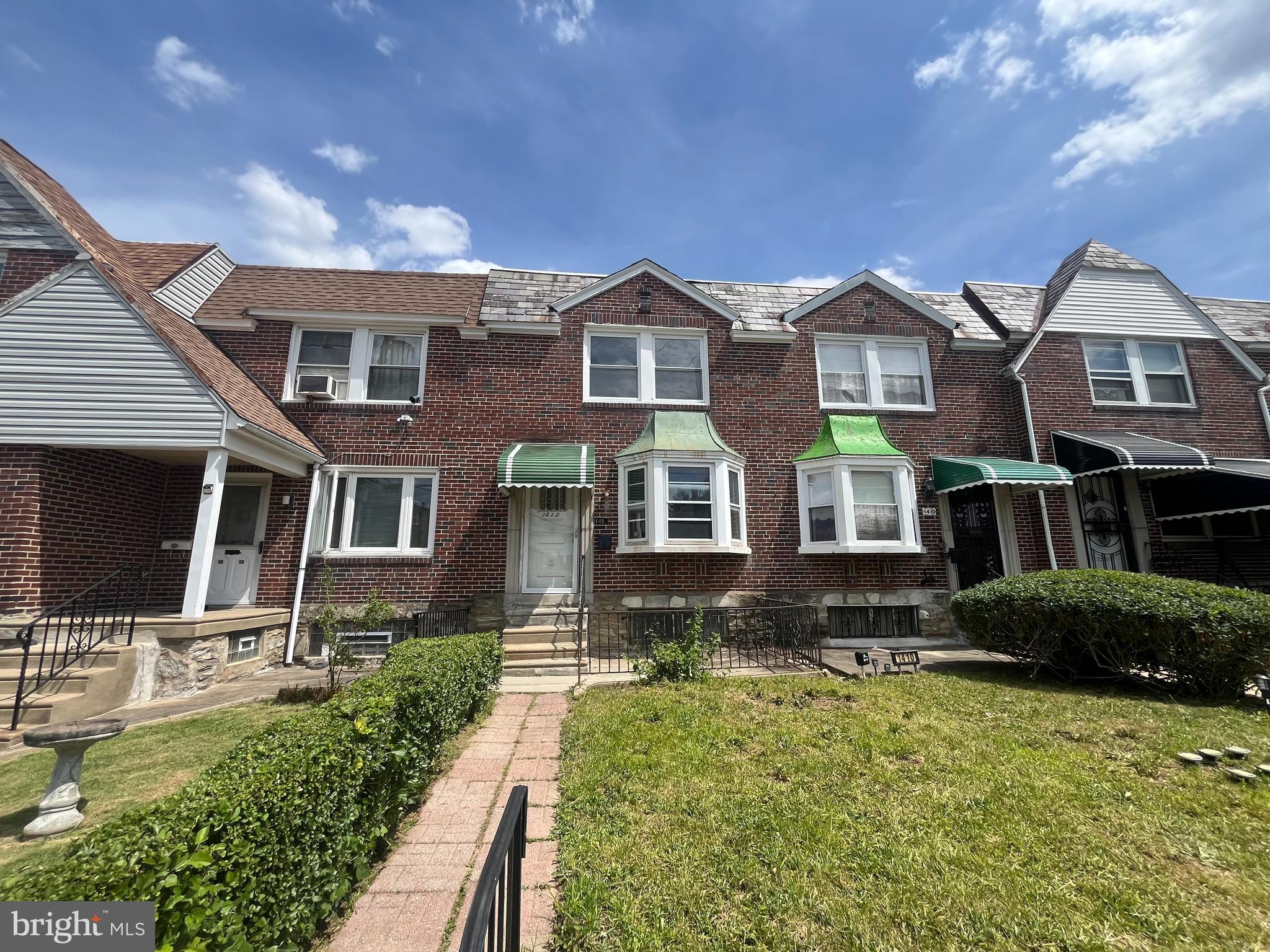 Welcome to this well-located two-story rowhome situated within the established Cedarbrook neighborhood of Philadelphia. Constructed circa 1950, the residence offers approximately 1,084 square feet of above-grade living area and reflects the durable construction and traditional design characteristic of mid-20th-century homes. The interior features a spacious living room, formal dining room, kitchen, and an upper level with three bedrooms and two full bathrooms. A full unfinished basement provides additional storage and includes walk-out access to the rear garage and private driveway parking. The property benefits from convenient access to major transportation corridors, including Stenton Avenue, Limekiln Pike, and Ogontz Avenue, providing excellent connectivity to surrounding neighborhoods, shopping and public transportation