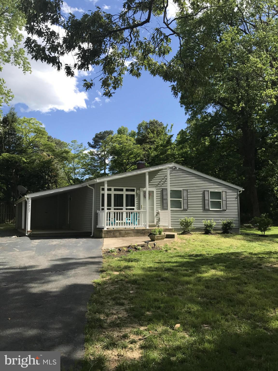 Must See Cute Like New  Rambler. This 3 bedroom 1 bath home features a galley kitchen with, Quartz counter tops and a pantry. Bathroom has porcelain floor and tub surround. Hardwood floors in living room, dining room and bedrooms. Family room with ceramic flooring in the lower level. Additional features included a storage shed, front and side porch, deck and new septic.
