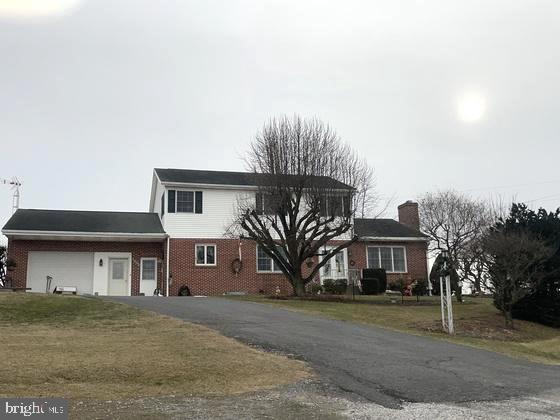 Upcoming Auction April 5th @ 12pm.
 1.55 Acres, Large 2 Story Brick & Vinyl sided Home w/ Approx. 3,000 sq. ft. of living space; Home was built new by Ray & Marie in 1964, many updates & renovations since; Large modern eat in kitchen w/ custom oak cabinets, Wall Oven, built in dishwasher, Refrigerator, flat top oven w/ overhead microwave, Large amount of cupboard space, Large living room w/ hardwood floors, & fireplace insert; 1 bedroom & full bath on main level, office/study; Large all season room w/ Pine Cathedral ceiling, double doors from room leads to large covered patio area, open patio w/ waterfall; Second level includes 3 bedrooms, 1 large full bath including master bedroom w/ walk-in closet,  Walk-in cedar wardrobe, clothes chute, plenty of storage space; Attached 1 car garage w/ workshop area, Full basement, partially finished w/ outside entrance, Home heats w/ outdoor woodstove, & oil burner, forced hot water heat; 200AMP service, onsite well, & septic, 30x40 enclosed shop/garage pole building w/ sliding front doors & man doors on ends; 10'x30 lean to addition, 16'x20' board & batten workshop/garden shed; beautiful views of mountain from this property; This home has been well maintained by owners, very nice property, owners have enjoyed this home for 60 years, & are downsizing, come prepared to buy;