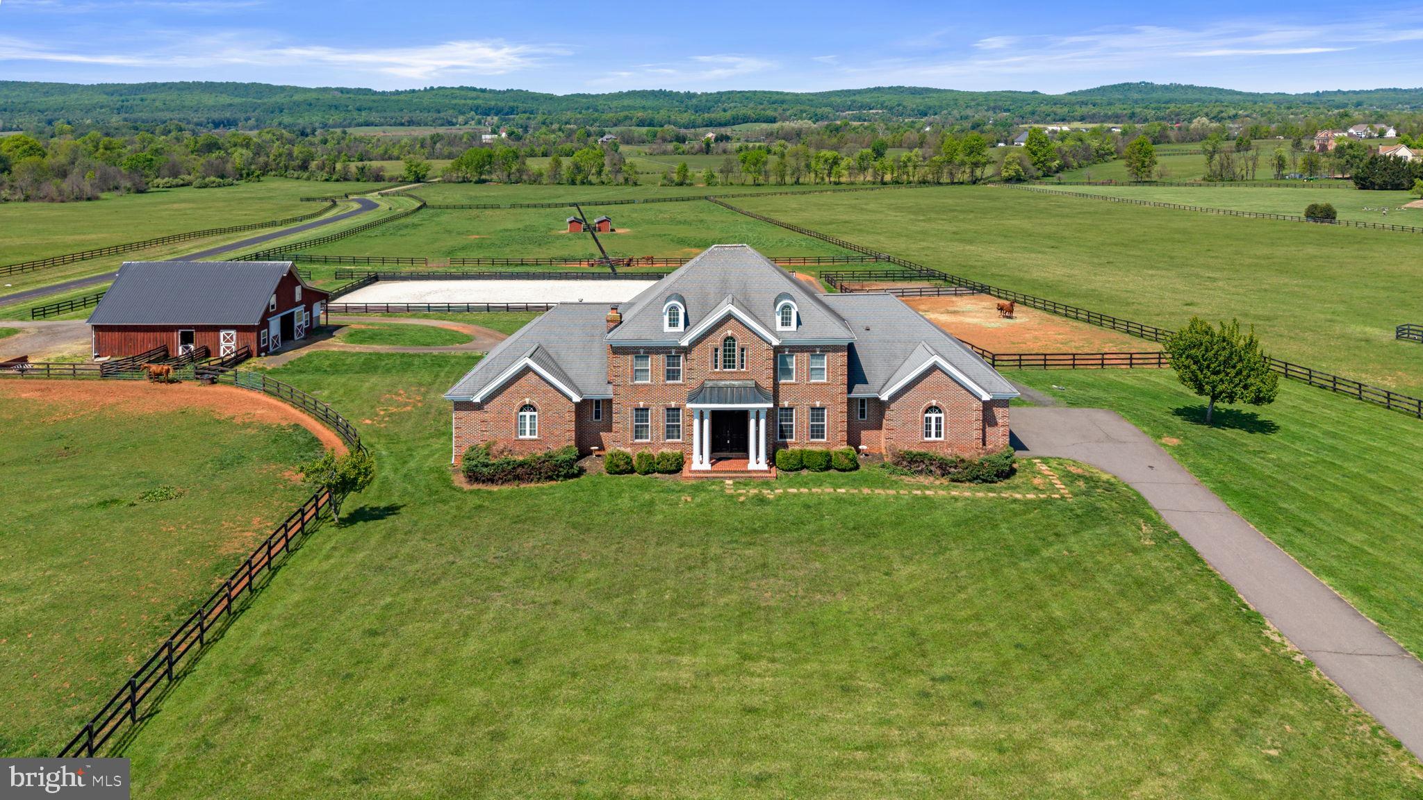 Discover a rare opportunity to own a working equestrian estate on over 10 private acres, just minutes from historic downtown Leesburg. This expansive 6-bedroom, 4.5-bath residence offers approximately 6,800 square feet on three finished levels, and main floor master bedroom.  

Inside, the main level is graced with crown molding and chair rail detail, anchored by a large kitchen that serves as the heart of the home. The open, flowing layout is ideal for both intimate gatherings and larger-scale entertaining.

Designed with horse lovers in mind, the property boasts a custom 6-stall barn featuring a spacious loft, well-appointed tack room with electric and water, a dedicated wash stall, and convenient auto-waterers. Outdoors, find seven fully fenced pastures - including two generous 3-acre fields - additional turnout areas, a run-in shed, a two-stall shed, and a 150’ x 75’ outdoor arena. All fencing and pasture improvements were added around 2016.

Seize this turnkey equestrian retreat offering privacy, scenic views, and easy access to Leesburg’s vibrant amenities. Whether for your own horses or rental income from boarding and pasture space, this is a truly exceptional offering in a coveted location.  Note the property border outline in the photos is approximate and not official.