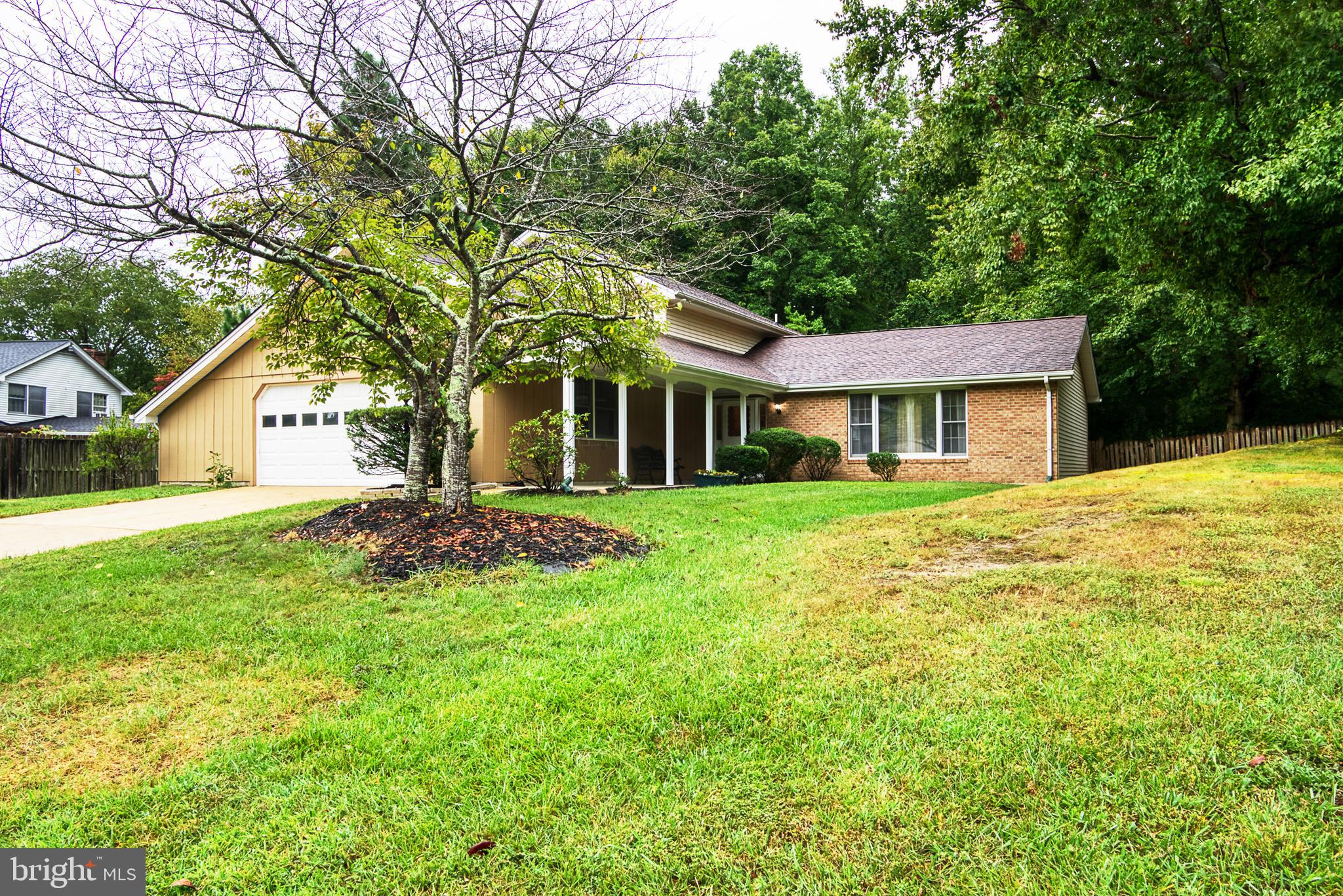 Location, location, location! This spacious 4-bedroom 3 bath split-level home is situated on a quiet cul-de-sac with a private fenced backyard. The main level living room, dining room and kitchen provide ample room for all. On the upper level you will find a Primary Bedroom complete with a full bath and walk in shower. The additional 2 bedrooms are nicely sized with a shared hall bath complete with a tub. The lower-level family room is spacious and includes a wood burning fireplace to cozy up on those cold winter nights. Enjoy relaxing in the light and bright Sunroom  with a separate heat and air conditioning unit. Step outside to enjoy the fresh air on the outdoor deck. Either is a great place to relax or entertain family and friends. New roof installed in 2020. Great commuter location to nearby Joint Base Andrews, Washington DC and Virginia.