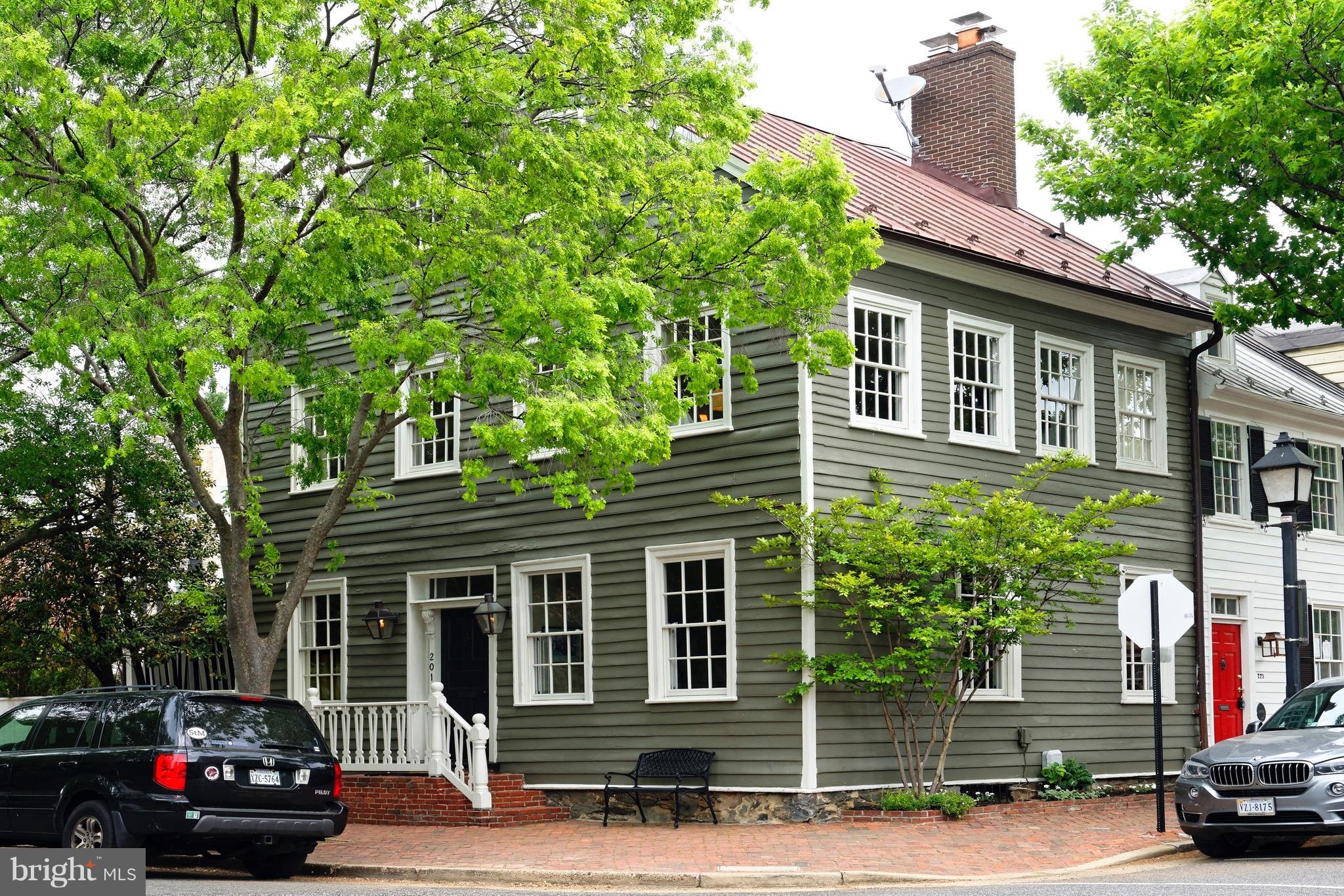 Premier Old Town home circa 1790, with 21st Century amenities and windows with abundant light on three sides!  Side porch and chef's kitchen both opening to beautiful garden with fountain.  Original heart pine floors, detailed moldings, 2 handsome fireplaces, 4 luxurious bedrooms, 3.5 renovated baths.  Exciting finished lower level with family room, large laundry and recently added wine cellar.