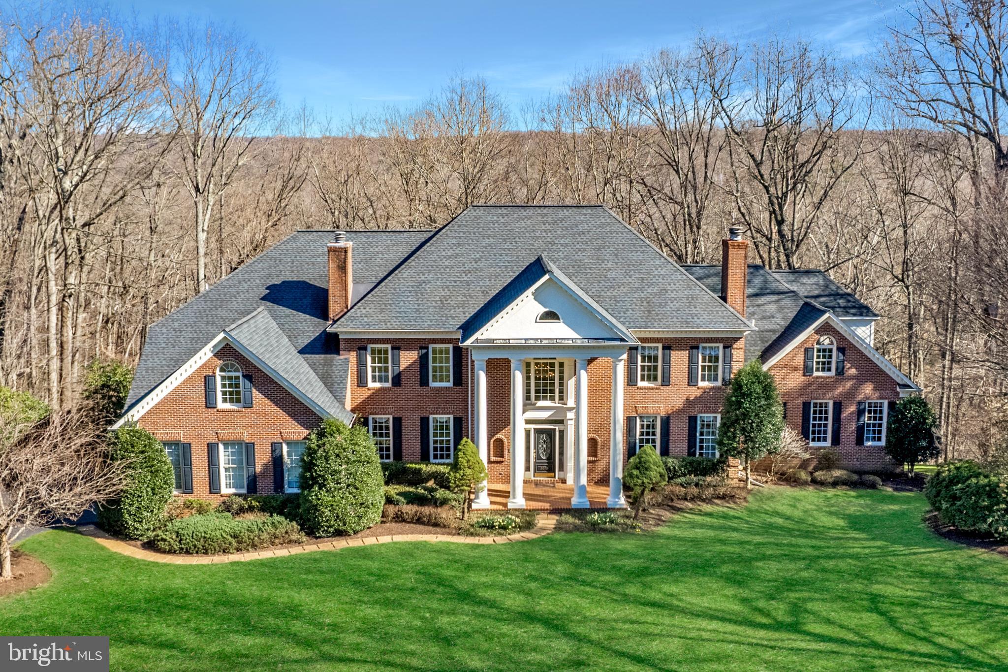 This custom-built residence, tucked away on a cul-de-sac in the Hunters Crest neighborhood of Vienna, is sited on a spectacular 1.75-acre lot overlooking picturesque Difficult Run, and located just minutes from downtown Vienna and all major commuter routes. With over 7,000 square feet of finished living space that includes 5 bedrooms, 5 full bathrooms, 2 half baths, this stately home will delight the most discriminating buyer. Rich in detail, with elegant moldings and millwork throughout, the home features 2 primary suites – main and upper levels, wonderful living areas, 2 private offices, and several outdoor decks accessible from multiple rooms. The unfinished lower level, with abundant windows and natural light, has the potential to be a fabulous entertainment hub for family and friends. This beautifully maintained home is perfect and waiting for you to enjoy.