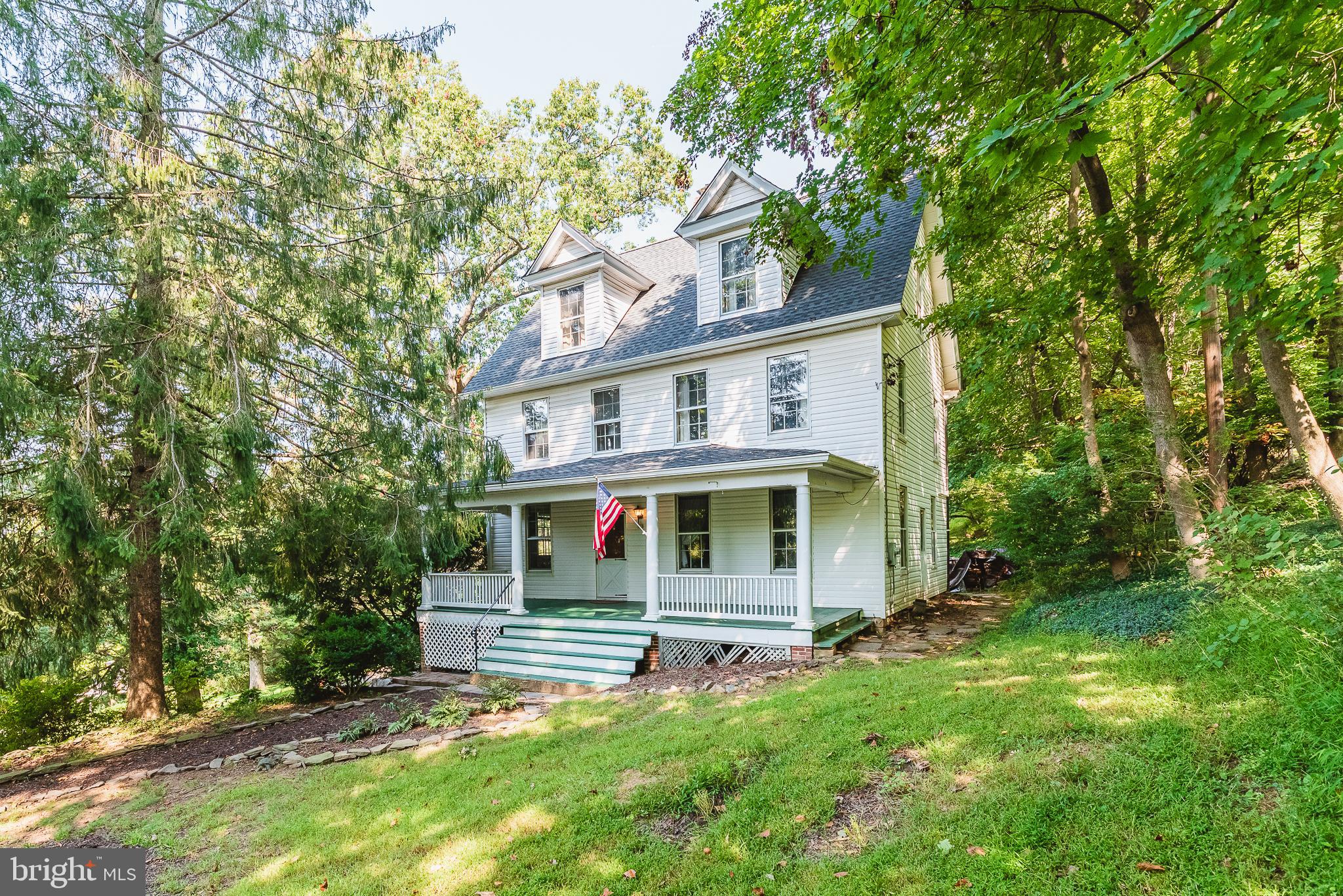 If you like "Vintage" then this is the home for you! This classic 3 story beauty is perched on an elevated setting with winter views of Hunt Valley. This has been the happy home for the same family for over 40 years! It's time to start your adventure here. Lovely features include a wide covered front porch, pocket doors, ornate light fixtures, a Living room with Fireplace, and a true "Parlor". Amazing room sizes, tall windows, and loads of natural light streams in even with the ample mature trees that give you a private oasis feel, though you are just minutes to I-83. A very nostalgic feel indeed but you won't need to sacrifice in this beautifully renovated kitchen with ample cabinet space, granite counters, island/breakfast bar, wine rack, wet bar, ceiling and undercabinet accent lighting. The 2nd level has the primary BR with ensuite bath, 2 additional bedrooms with bedroom 3 having access to the walk-up attic. The massive mostly finished attic has BR # 4, a half bath, and 3 other spacious versatile use areas. Well maintained but selling As-Is. One Year Cinch Home Warranty Included!