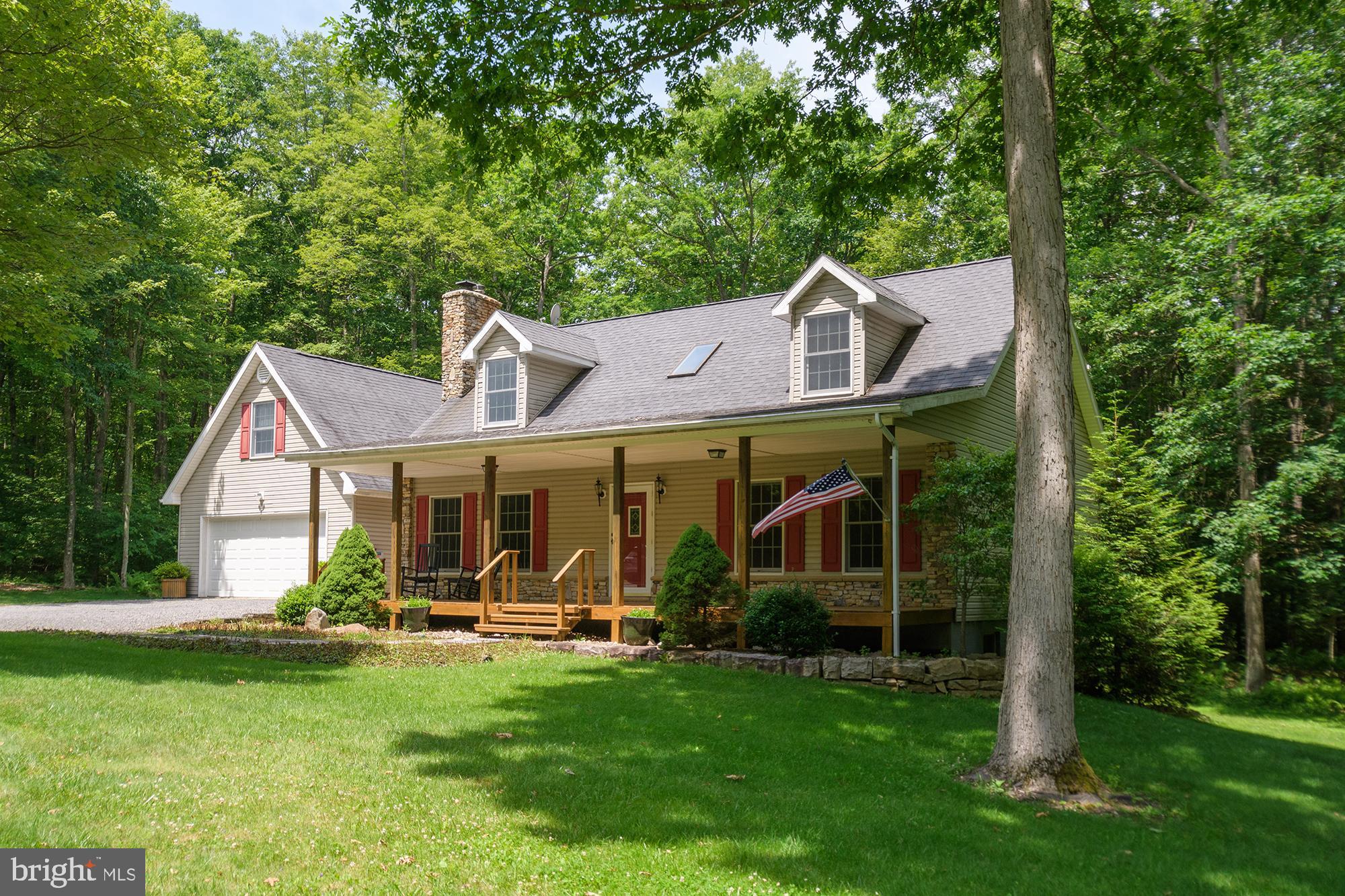 3/4 BR, 3BA well-built & cared for home, 2700sf+/- in Maple Del, a private community in the Red Run area of Deep Creek Lake. Natural boulders lace the property; tall mature maples, oaks & pines offer plenty of shade but still ample lawn for outdoor activities. Surrounded by ferns, chirping birds and peace & quiet that's rare this close to the lake. You will love the cozy covered porch! Inside, you'll find custom tile floors, woodburning stove, custom wood trim, Anderson Windows and various handicap accessible features throughout. Potential for main level living, the 2nd living room was used a primary bedroom for some time. Laundry room/mud room on the main level connecting to the garage. Multiple heat sources, including an efficient hot water baseboard system. Finished basement was used as a woodshop and is thoughtfully designed. Huge finished area above the garage could serve as a 4th bedroom, home office, or heated storage.