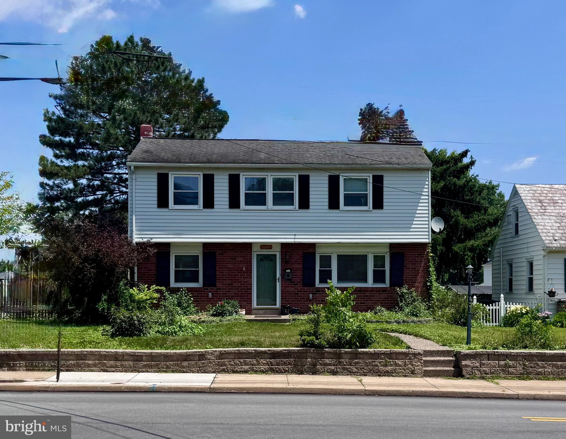 Welcome to 139 N Main Street—this beautifully upgraded 3‑bedroom, 1.5‑bath home located in the highly regarded award‑winning North Penn School District. Thoughtfully improved and exceptionally versatile, this property offers comfortable everyday living along with standout features rarely found at this price point.  This property also features a flexible main‑level bedroom complete with its own half bath, perfect for guests or easily repurposed as a dedicated home office.
An updated kitchen with oak cabinetry, tile flooring, backsplash and newer appliances flow into the dining room—complete with hardwood floors and sliding doors that overlook an exceptionally private, fenced‑in backyard. Outdoor living is a dream with both a 10' x 12' raised wooden deck and a 21' x 12' cement patio, perfect for entertaining, grilling, or quiet relaxation.

A short flight of stairs leads to a spacious living room filled with natural light from a large picture window. Just off this level is a main‑floor bedroom with its own half bath and sitting area, offering ideal flexibility as a guest room, office, or private retreat.

The lower level features an inviting family room accented by a brick wall, a wood‑burning stove, and direct access to the backyard—an excellent space for gatherings, play, or cozy evenings at home.

Upstairs, you’ll find two additional bedrooms, including one with a charming sitting area, along with a remodeled hall bath.

Car enthusiasts, hobbyists, or anyone needing extra storage will appreciate the oversized 2‑car garage plus an additional 2‑car parking area, providing rare and valuable convenience.

A warm, upgraded home with flexible living spaces, abundant parking, and top‑tier schools—this property offers exceptional value and privacy in a sought‑after location.   Schedule your tour today as this home is expected to sell quickly.