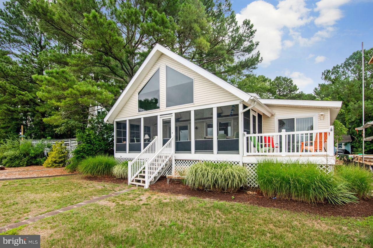 Waterfront living starts here at 36 Teal Circle in Ocean Pines. Whether you're an avid boater or simply enjoy relaxing by the water, this home offers a private dock including an 8,000 boat lift and the waterfront lifestyle you've been looking for.
Located in the amenity-filled community of Ocean Pines, residents enjoy access to multiple pools, a championship golf course, marina, yacht club, parks, walking trails, tennis and pickleball courts, and the Ocean Pines Beach Club. 
Inside, you'll find an inviting living space with 4 bedrooms, an additional flex room upstairs with two skylights, a 3 season porch with beautiful water views featuring two additional skylights that bring in natural light. A newer roof provides added value and peace of mind.
This is a great opportunity to own an affordable waterfront home and enjoy everything the water front living in Ocean Pines has to offer.