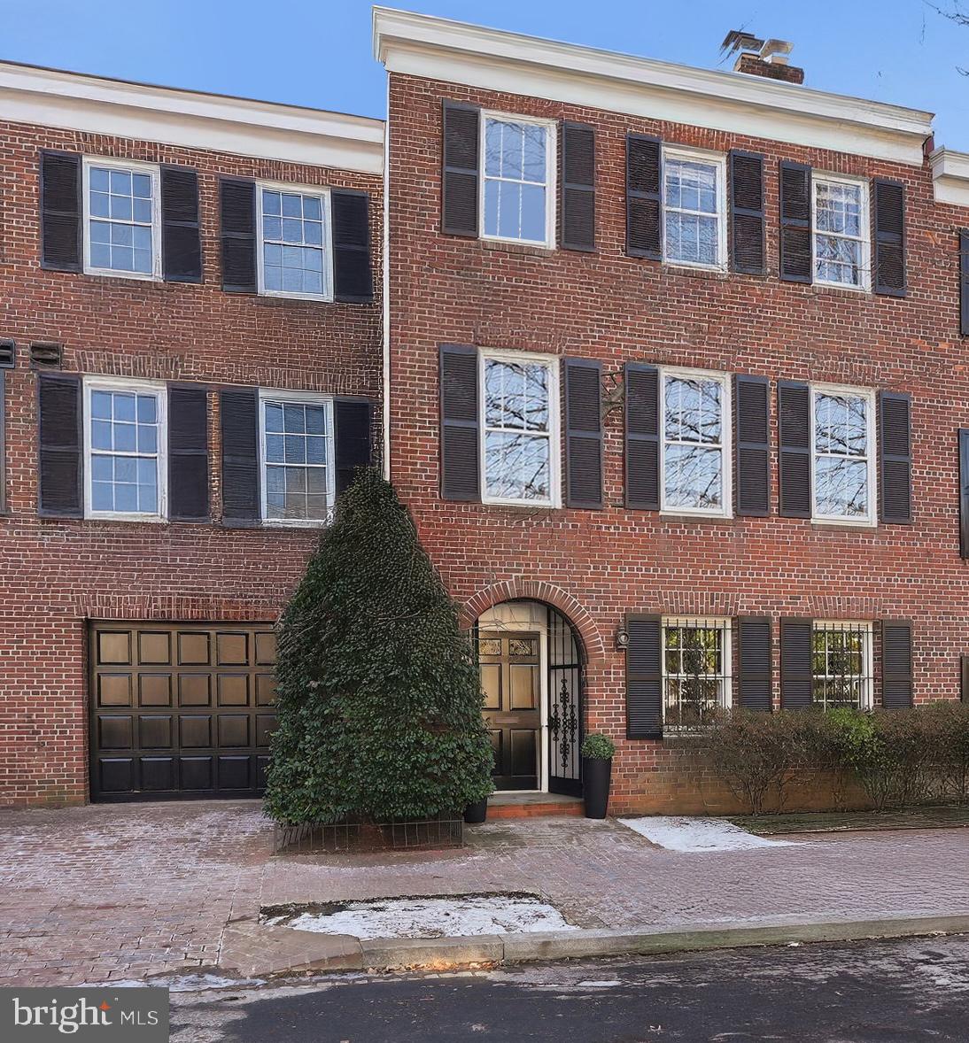 Located in Georgetown’s West Village this gorgeous four-story residence features high ceilings, gracious proportions, exceptional indoor-outdoor living plus rare 2 car parking. Offering 4 Bedrooms, 3 Full & 1 Half Bathroom plus Bonus Attic Room and approximately 4,351 total square feet, the home seamlessly blends classic architecture with thoughtful modern upgrades. The entry level is home to the fourth Bedroom with a lovely fireplace and en-suite Bathroom, a full-size Laundry Room and oversized Garage with interior access. The second level boasts a grand double Living and oversized Dining Room complete with wood-burning fireplace, beautiful built-in bookshelves and expansive ceiling heights. The main living level also features a gracious updated Kitchen with marble countertops and new appliances and elegant Powder Room. Beautiful French glass doors unveil an exceptional private outdoor oasis with landscaped gardens, patio space and a private salt chlorinated pool, creating a true resort-like setting in the city. Upstairs, the bedroom level provides generous accommodations, including a serene Primary Suite, additional well-proportioned bedrooms, and a lofted fourth floor bonus room with skylight—ideal as an office, lounge, or creative retreat—plus added storage. Recent improvements include a new roof (2025), new heating system, reclad chimney and a new smart-technology washer and dryer. Completing the offering is coveted two-car parking, including an oversized one-car garage with interior access into the house plus an additional surface parking space, and electrical capacity for an EV fast charger. A rare combination of grand scale, privacy, parking, and pool living—this is Georgetown living at its finest.