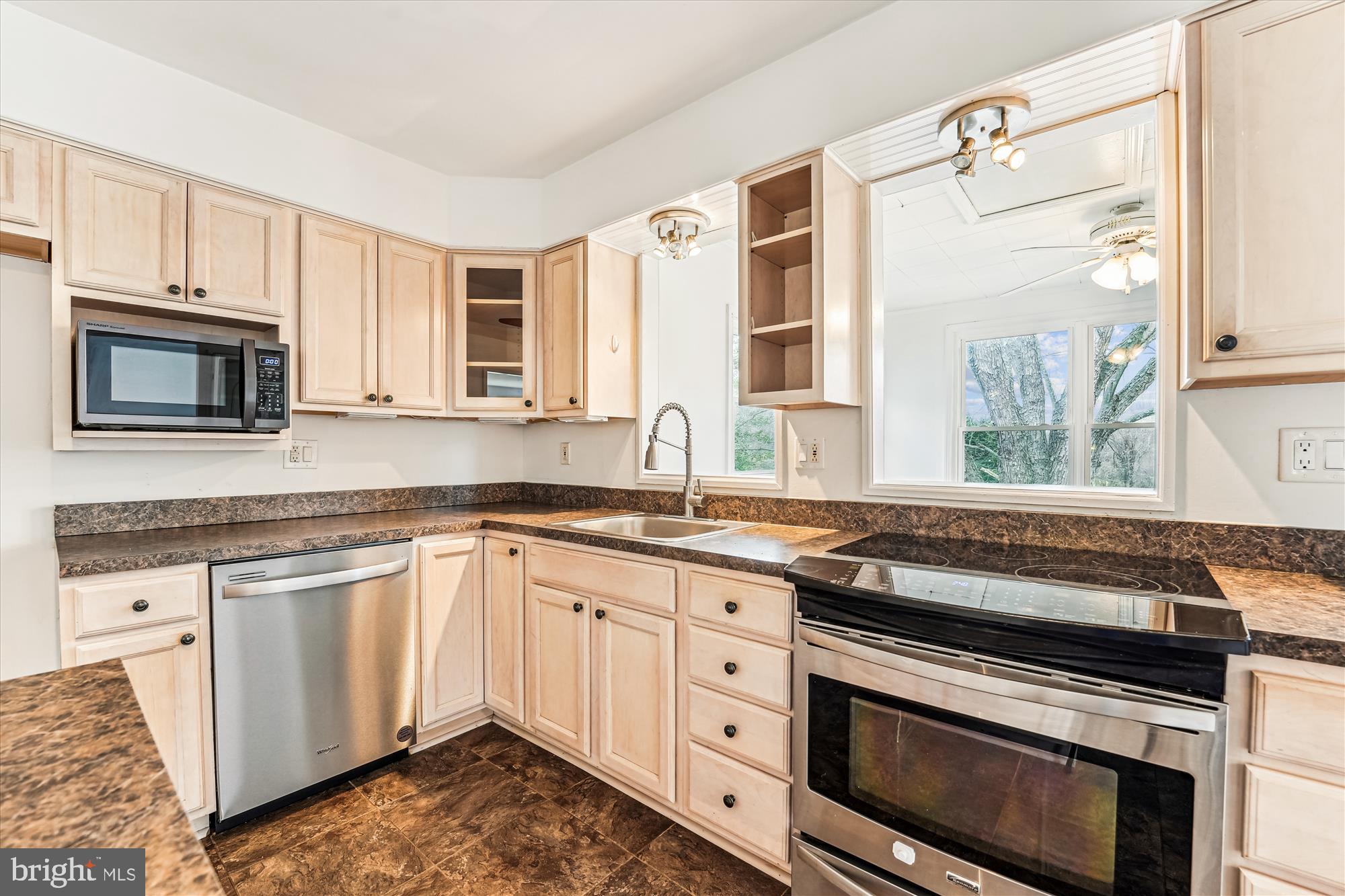 PRICE IMPROVEMENT AND A MOTIVATED SELLER!   --Welcome to 8475 Wedding Drive! This impeccably maintained 4-bedroom, 3-bath split foyer home offers over 2,600 square feet of finished living space on a peaceful and mostly cleared 3-acre homesite. This property offers a rare blend of privacy, flexibility, and modern upgrades—an ideal setting for those seeking a rural lifestyle with easy access to major routes or the ability to work from home (FIOS). 
        Step inside to find a bright, open-concept layout with beautifully refinished solid hardwood floors and fresh interior paint throughout. The renovated kitchen features stainless steel appliances, updated cabinetry, luxury vinyl tile flooring, a center island for preparation space and extra cabinet storage, and a separate coffee bar that’s perfect for your morning routine. Adjacent to both the kitchen and dining room is the breakfast room, which features an abundance of natural lighting and overlooks the rear yard, offering walkout access to a spacious, step-down deck—ideal for entertaining or simply enjoying the quiet rural setting.
        Upgrades include a newer roof, a recently replaced HVAC system and furnace, newer double-hung vinyl windows, and a finished, oversized garage that doubles as a workshop, previously converted from the original carport. The walkout lower level offers additional living space with a large recreation room featuring a custom brick wood-burning fireplace, a fourth bedroom that functions perfectly as a guest suite or Au Pair space, a full bath, and a walkout laundry/mud room. There is even direct access to the garage from the lower level.
       The surrounding land offers space and flexibility rarely found, making it perfect for gardening, keeping animals, adding a barn or outbuilding, or even expanding the home if desired. With the property’s layout, zoning, and rural setting,  it’s a great candidate for a small farmette setup.
        Located in the heart of Welcome, Maryland, this property offers a unique blend of rural charm and convenience. It’s just minutes from Maryland Route 6, providing easy access to La Plata, Port Tobacco, and the greater Washington D.C. metro area. Nearby attractions include the Thomas Stone National Historic Site, the Port Tobacco Historic District, and an array of recreational options like boating, fishing, hunting, hiking, or some limited equestrian activities at Chapel Point State Park, Cedar Point Wildlife Management Area, or Nanjemoy Wildlife Management Area with combined acreages of more than 4,000 acres! 
     This is your opportunity to enjoy peaceful country living with room to grow, inside and out. Schedule your private tour today—this one won't last long!