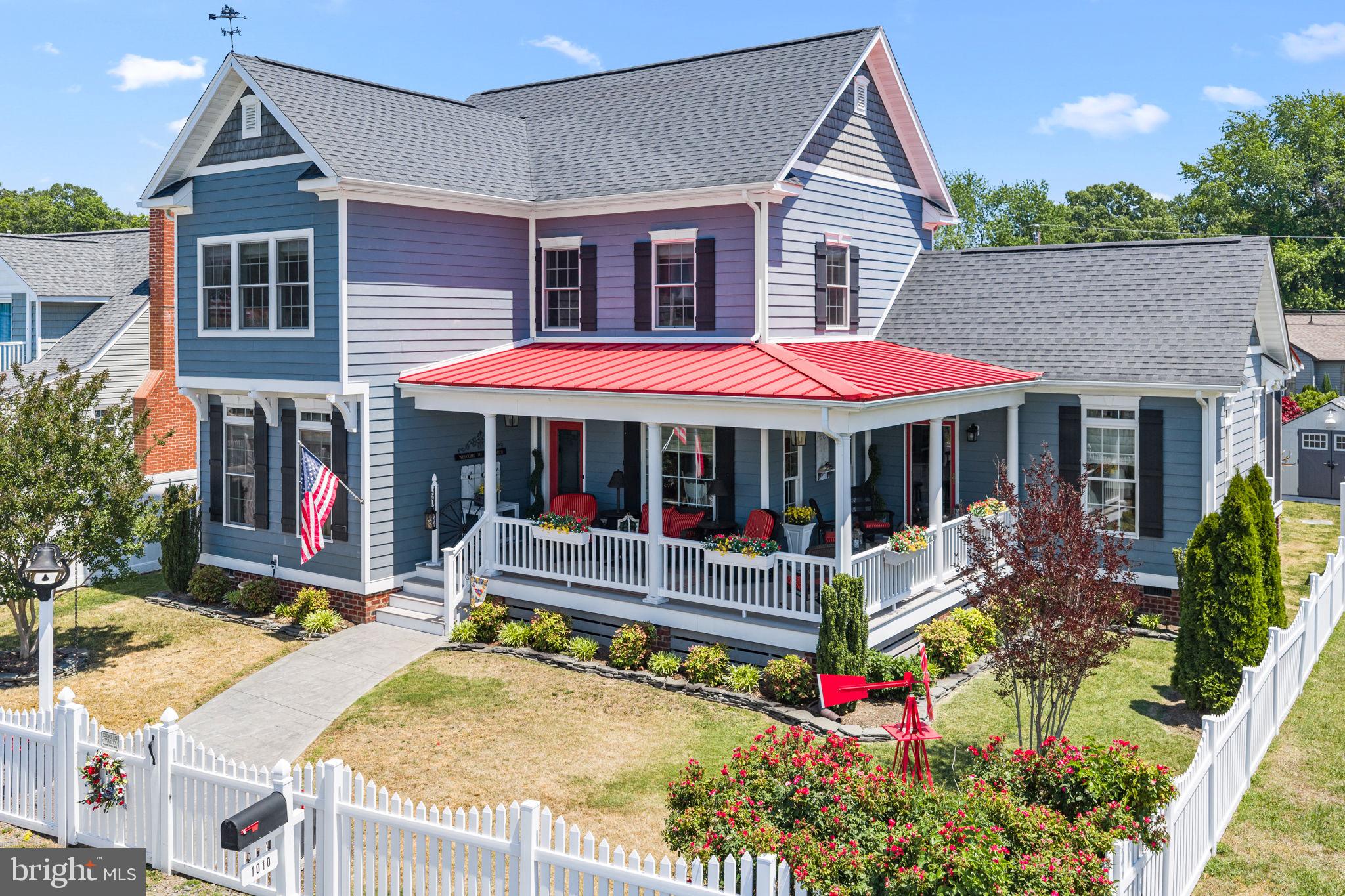 WATERVIEW ON THE POINT: Much admired since it first graced Monroe Bay Ave. in 2016, this exquisite 4 Bedroom, 2.5 Bath home, with private pier access, was thoughtfully designed to capture the scenic water views and offer the very best of casual coastal living in this charming riverfront town. You will feel the welcoming warmth of this home from the moment you walk in, as the spacious and comfortable living spaces are bathed in natural light, with views of Monroe Bay from nearly every room. The stunning Great Room is the heart of this home, with seamless flow between the main living area, dining area and kitchen. The living area boasts a vaulted ceiling with exposed beams, floor-to-ceiling windows which bring the outdoors in, a custom built-in cabinet with antique glass-front doors, and easy access to the sunroom and side porch. The beautiful and functional kitchen offers ample cabinetry, an island with bar seating, granite counters and tile backsplash, and stainless steel appliances, including two ovens. The dining area can accommodate a large table for family gatherings and easy entertaining. Wake each morning to gorgeous bay views from the main-level Primary Bedroom retreat.  The ensuite bathroom has a custom tile shower, double sinks, two closets, and linen storage. The first floor also features a separate family room with built-ins and a cozy gas fireplace for chilly evenings; a wonderful three-season sunroom that opens onto the backyard oasis; a dedicated office, a half-bath, and laundry room. Upstairs are three additional bedrooms–two with water views–a full bathroom, and a sizable storage room. Outside you can enjoy the spectacular views, sunsets and bay breezes from the charming wrap-around front porch: coffee in the morning, cocktails in the evening–a perfect setting any time of day.  The private backyard is fully-fenced and features a wonderful stamped-concrete patio with pergola which is perfect for outdoor dining and entertaining, as well as a storage shed for beach gear and lawn equipment.  There is a two-car attached garage and off-street parking with ample space for vehicles and a must-have golf cart!  This home was custom-built with high-quality details and finishes throughout including  2” x 6” framing, 9’ ceilings with elegant crown molding and baseboards, wide-plank, engineered hickory wood flooring, zoned HVAC; and premium exterior finishes renowned for their beauty and ease of maintenance including James Hardie siding, composite decking, stamped concrete patio and sidewalk, and distinctive metal porch roof. Home conveys with a shared pier agreement with the adjoining property owner. The sellers moor their 35’ cruiser at the pier year-round.  Bring your boat, personal watercraft, kayak or paddle board, or just enjoy the peaceful sights and sounds of the waterfront from a comfy deck chair. A quick five-minute boat ride will bring you out of the protected waters of Monroe Bay and into the beautiful Potomac River for great fishing or a peaceful cruise.  Conveniently located on The Point in Colonial Beach where you can walk, bike, or golf cart to public beaches, restaurants, galleries, shopping, and marine services—all less than 90 minutes from Richmond and the DC metro area. Whether you’re seeking a full-time residence or a vacation getaway, this property offers the ideal blend of space, comfort and coastal living at its finest in Virginia’s historic Northern Neck.