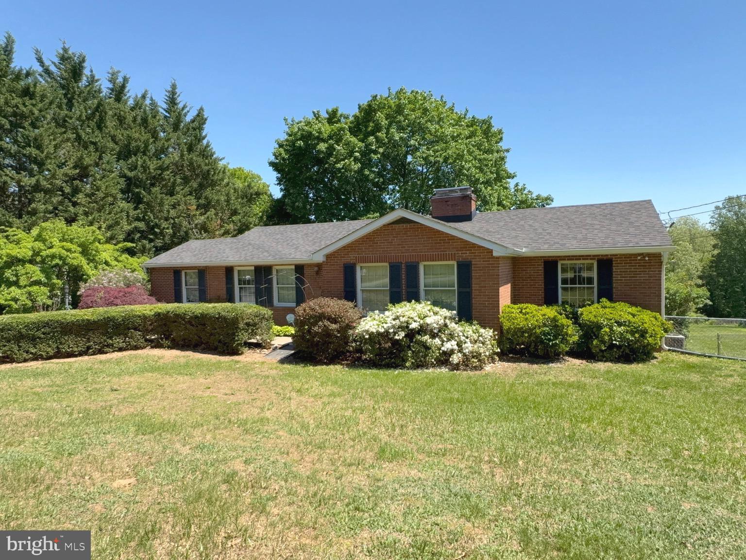 RESTORE THE GLORY & CREATE LASTING MEMORIES! Welcome to 4215 Buffalo Road, a sprawling 1965 brick rancher awaiting its next chapter. Nestled on a stunning 1.28-acre lot in Mount Airy, this home offers the rare opportunity to move in and modernize at your own pace while building significant equity. With nearly 3,000 total square feet of finished living space, the foundation is here to create your dream forever estate.

Major exterior updates have already been tackled, including a recently replaced roof, gutters, and downspouts, providing a solid start to your renovation journey. The main level features a spacious and functional layout with a wood-burning fireplace, three bedrooms, and two full baths. The walk-out lower level provides incredible flexibility, featuring an additional wood-burning fireplace, two additional bedrooms, and a third full bath—perfect for a multi-generational suite, a home office, or a massive recreation hub.

The backyard is a private sanctuary waiting to be revitalized. The fiberglass inground pool is a major value-add that just needs some professional attention to return it to its former glory. Once restored, it will be the centerpiece of an outdoor oasis where your family can spend summers splashing and making memories for years to come. Enjoy the tranquility of a large lot within the highly-rated Carroll County school district, just minutes from downtown Mt. Airy. Sold strictly AS-IS.