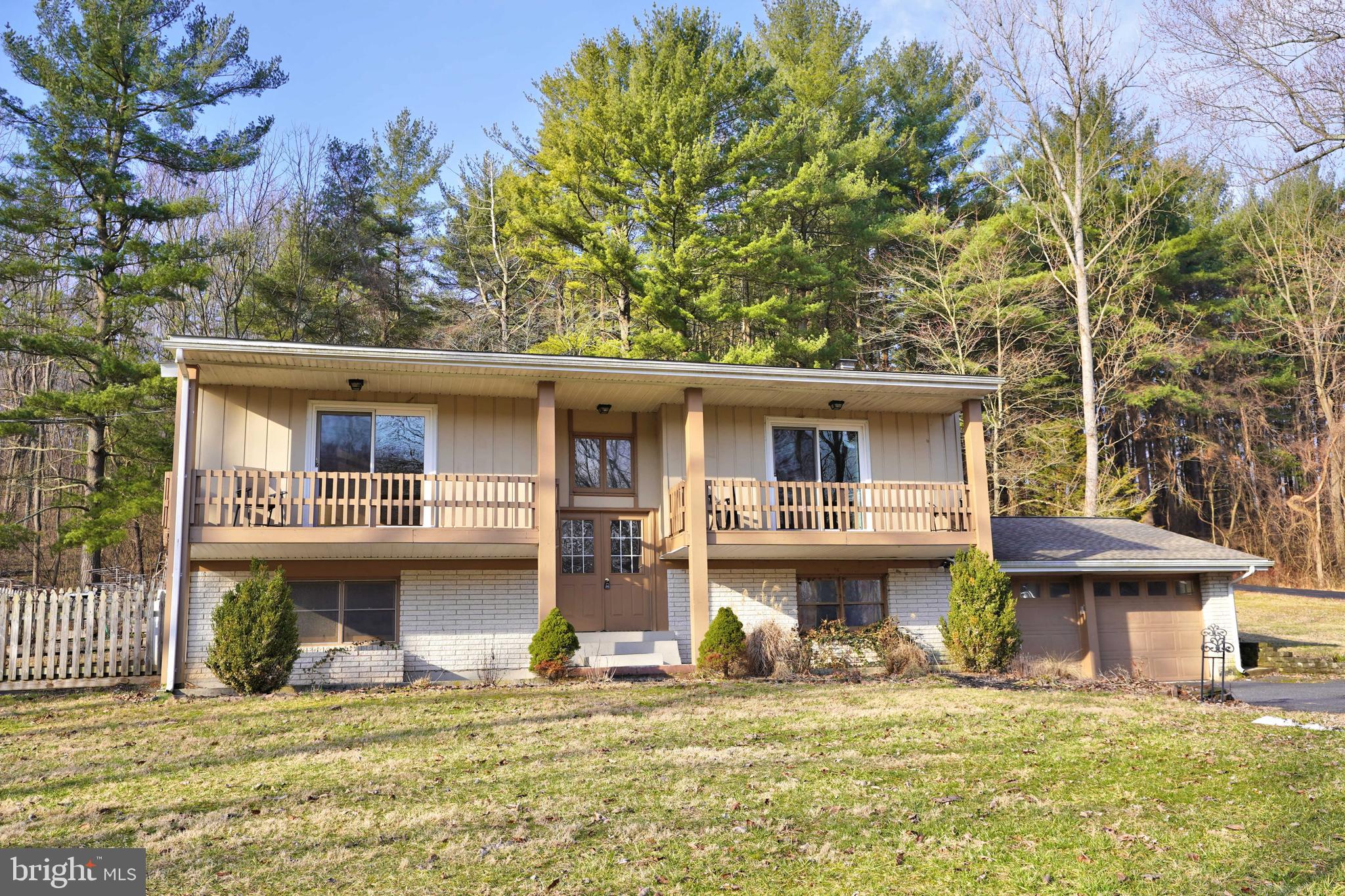 3 bedroom, 1 bath, split-foyer home located on a picturesque setting south of Hanover.  Travel back a long driveway, cross the bridge over the creek, to the peaceful 1.8 acres of privacy, bordering woods, with a deck to enjoy the outdoors.  Lower level recreation and family rooms, with wood stove.  2-car garage. Utility and storage rooms.
