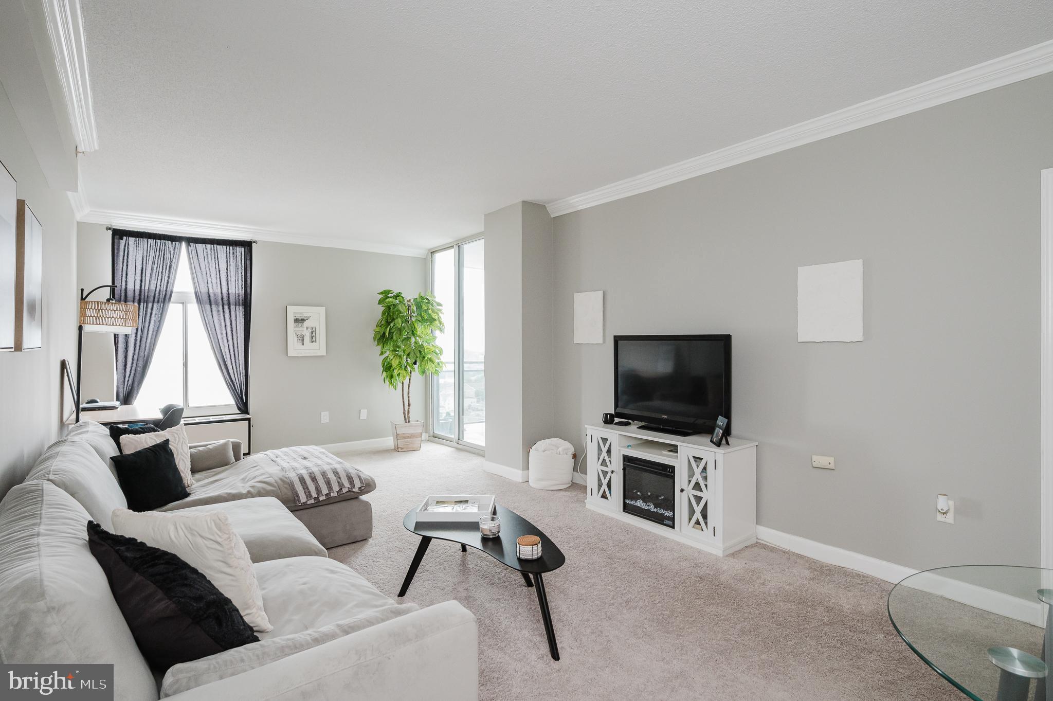 Welcome to the highly sought-after Penthouse Condominiums in the heart of Towson! This well-maintained 1 bedroom, 1 bathroom condo offers comfort, convenience, and low-maintenance living with an impressive list of community amenities. The updated kitchen features stainless steel appliances, granite countertops, and updated cabinetry. The light-filled living room and dining area boast plush carpeting, crown molding, and beautiful views overlooking the heart of Towson. The spacious bedroom includes plush carpeting, crown molding, generous closet space, and direct access to the private balcony with table space — the perfect spot to relax and unwind. The clean and well-kept bathroom offers a tub/shower combo, and the convenience of an in-unit washer and dryer makes everyday living easy. Additional highlights include abundant closet space, trash chutes on every floor, and dedicated bulk trash and recycling collection areas. Residents enjoy exceptional amenities including a heated outdoor pool, library/meeting room, event space, fitness center, game room, and 24/7 concierge attendants. Optional basement garage parking is available for an additional monthly fee. Ideally located just moments from Towson Town Center, restaurants, shopping, entertainment, major commuter routes, and Towson University, this condo offers the perfect blend of convenience and lifestyle!