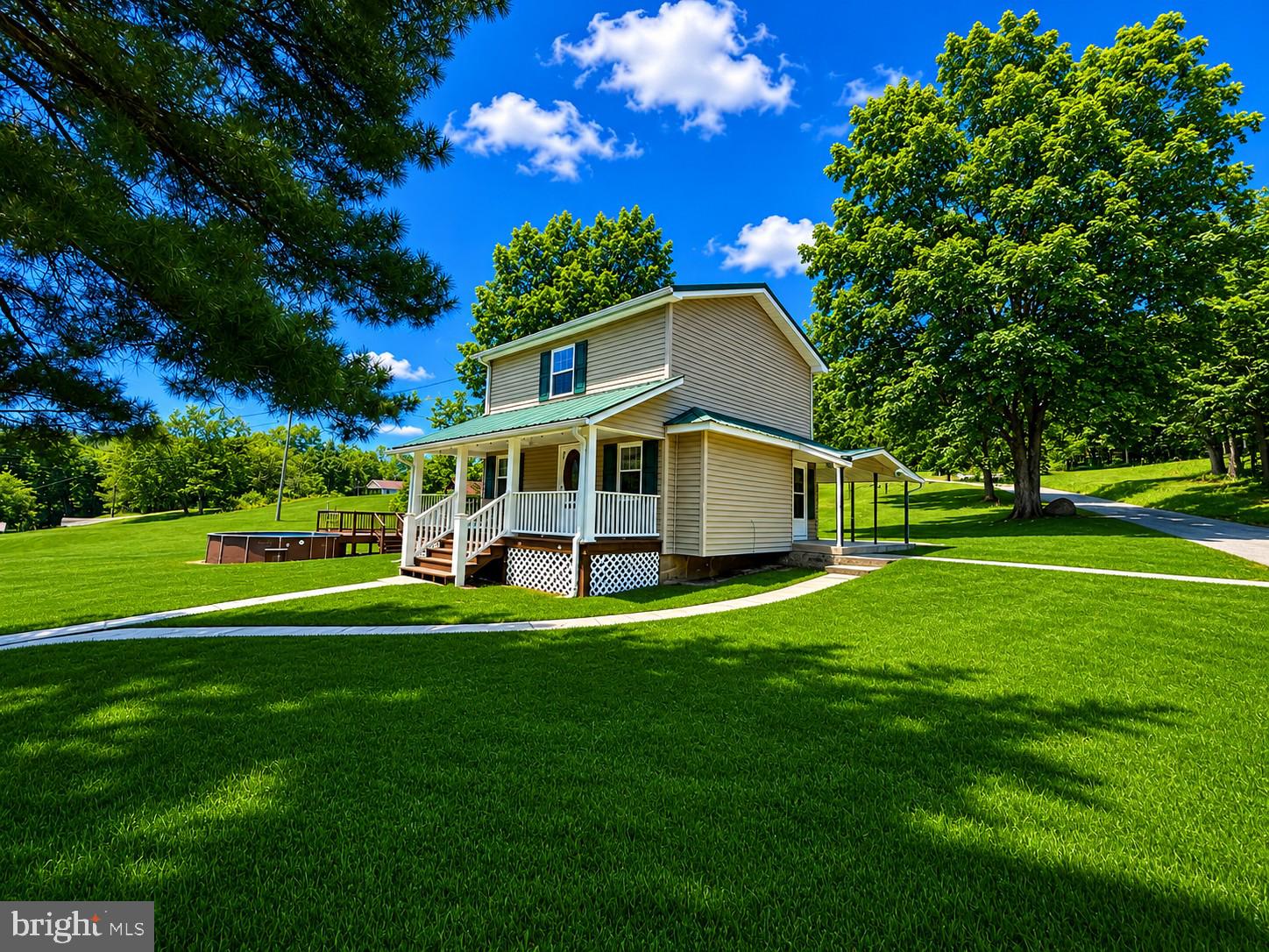 Completely transformed from top to bottom in 2017, this stunning Barton home delivers the perfect combination of modern updates, small-town charm, and outdoor enjoyment. Situated on a beautiful, picturesque lot, 23916 Kyle Hill Road offers the kind of move-in-ready experience buyers dream about—where the work has already been done and all that's left is to enjoy it. From the inviting front porch to the cozy rear porch, every inch of this property feels warm and welcoming. Inside, you'll find a beautifully updated interior highlighted by a stylish kitchen featuring stainless steel appliances, abundant cabinetry, and a spacious breakfast bar that's perfect for gathering with family and friends. Main-level laundry adds everyday convenience, while the thoughtful renovation provides the comfort and efficiency of modern living. The extensive 2017 renovation included updated HVAC with heat pump and central air, electrical wiring, plumbing, drywall, windows, roof, siding, soffit, fascia, and gutters—offering peace of mind for years to come. Outside, the fun continues with an above-ground pool, playset, and plenty of room to spread out, entertain, or simply enjoy the scenic surroundings. Whether you're sipping your morning coffee on the porch, hosting summer pool parties, or relaxing under the stars, this property offers a lifestyle that's hard to find at this price point. Beautifully updated, impeccably maintained, and bursting with charm, this is more than just a house—it's a place you'll be proud to call home.