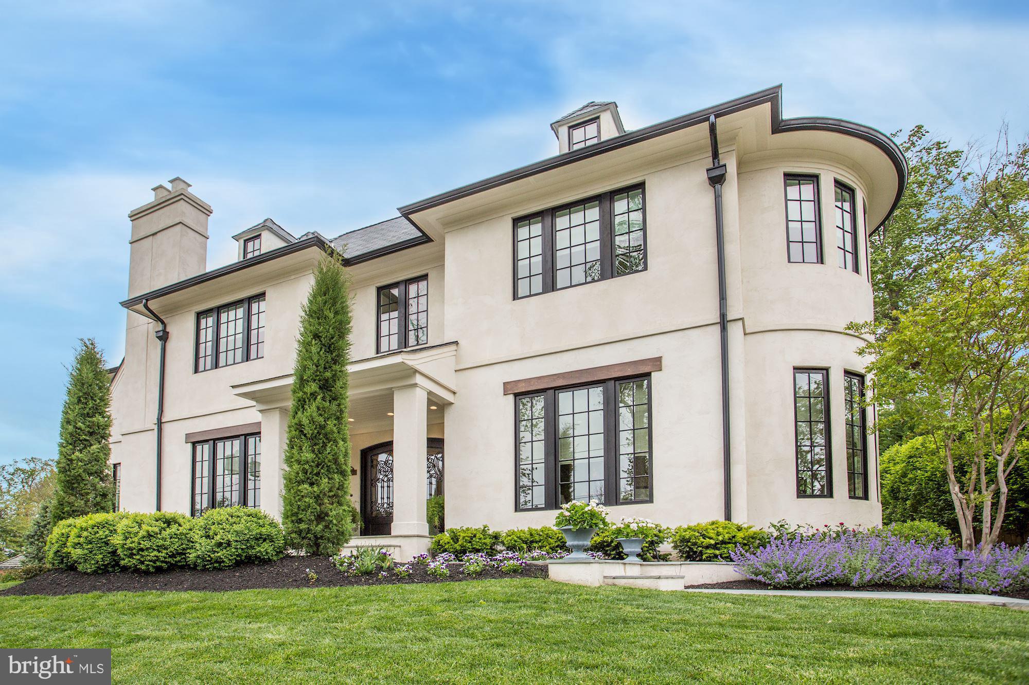 Exquisite French Country Stucco Home in Prime North Arlington Location designed with Special Attention to Scale, Proportion, Light and Livability - Authentic Stucco Exterior and Steep, Flared EcoStar Slate Roof - Custom Wrought Iron Entry Doors of Size - Classic French Country Rounded Turret filled with Windows accentuating Library and Upper Level Master Bedroom - Elevator to all Three levels - Main Level Master Suite with Dual Side by Side Marble Baths featuring Rohl Fixtures and Heated Floors. Two Walk-in Closets. Great Room designed for multi-functional Living, Dining and Media Space highlighted by Handsome Francois Limestone 50 inch Gas Fireplace with multiple French Doors providing access to Private Courtyard and Inviting Screened Porch - 11 foot Coffered Ceilings on First Floor and Notably Large Multi Pane Windows flood the Home with Natural Light - 5 Inch Custom Stained Hickory Plank Floors through out Main Level and Handcrafted Herringbone Pattern in Welcoming Large Foyer - Custom Woodwork includes Built-in Bookshelves and Cabinets in Library and Office, Cubbies in Mudroom and Pocket Doors - Kitchen anchored by 12 x 4 Island of Quartzite and features 48 inch Gas Cooktop, Appliance Wall with Double Ovens, Warming Drawer, Paneled 30 inch Refrigerator and 24 inch Freezer - Butlers Pantry includes an Ice Machine, Second Dishwasher, Dual Refrigerator Drawers, Undercounter Dual Zone Wine Unit as well as wonderful storage. Laundry Room is adjacent - Elegant Powder Room with Slate Floor and Floating Cabinet - Three Upper Level En Suite Bedrooms with Walk-in Closets - Lower Level with Pickle Ball Court, Golf Practice Room with netting and mat as well as set up for Buyers Golf Course Simulation Technology, Wet Bar, En Suite Bedroom and Loggia with Hot Tub - Professionally Landscaped Exterior with Sprinkler System and Lighting, Driveway paved with Permeable Pavers, Two Car Oversized Garage - Generator, Security System with Cameras, Sound System and Motorized Window Coverings on many Main Level Windows - Partially Fenced Flat Backyard