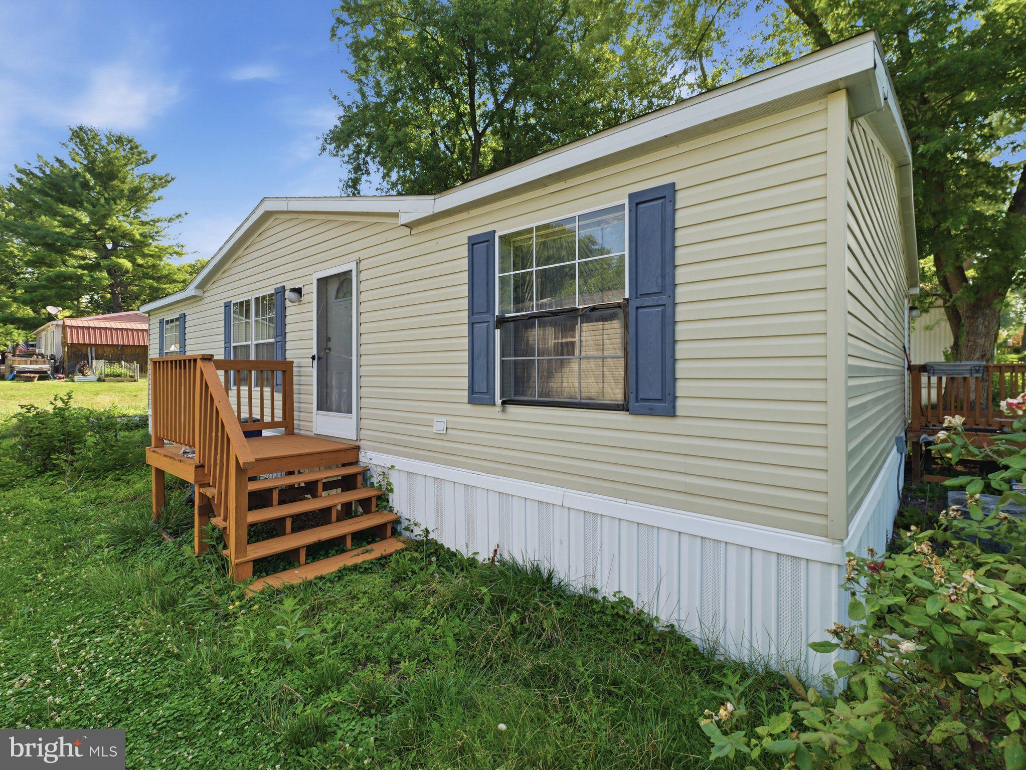 Affordable living with a lot of square feet for the money!   Spacious 3 bedroom, 2 full bath home on one level.   This is a double wide unit with plenty of space for entertaining.   Large living room with dining room attached and spacious kitchen.   Laundry facilities on the main floor.   Large closets.   Huge soaking tub in Owner's bath.  Outside area has been kept for flowers and vegetables and fruit trees.  The desirable Lakeside Community offers swimming pool, fitness center and large room for holding events available to residents only.   Lot rent is $750 / month and comes with trash removal, snow removal and water.  The Lakeside community must approve all buyers.  This home is convenient to shopping restaurants and has easy access to Route 81 and 70 for commuting.