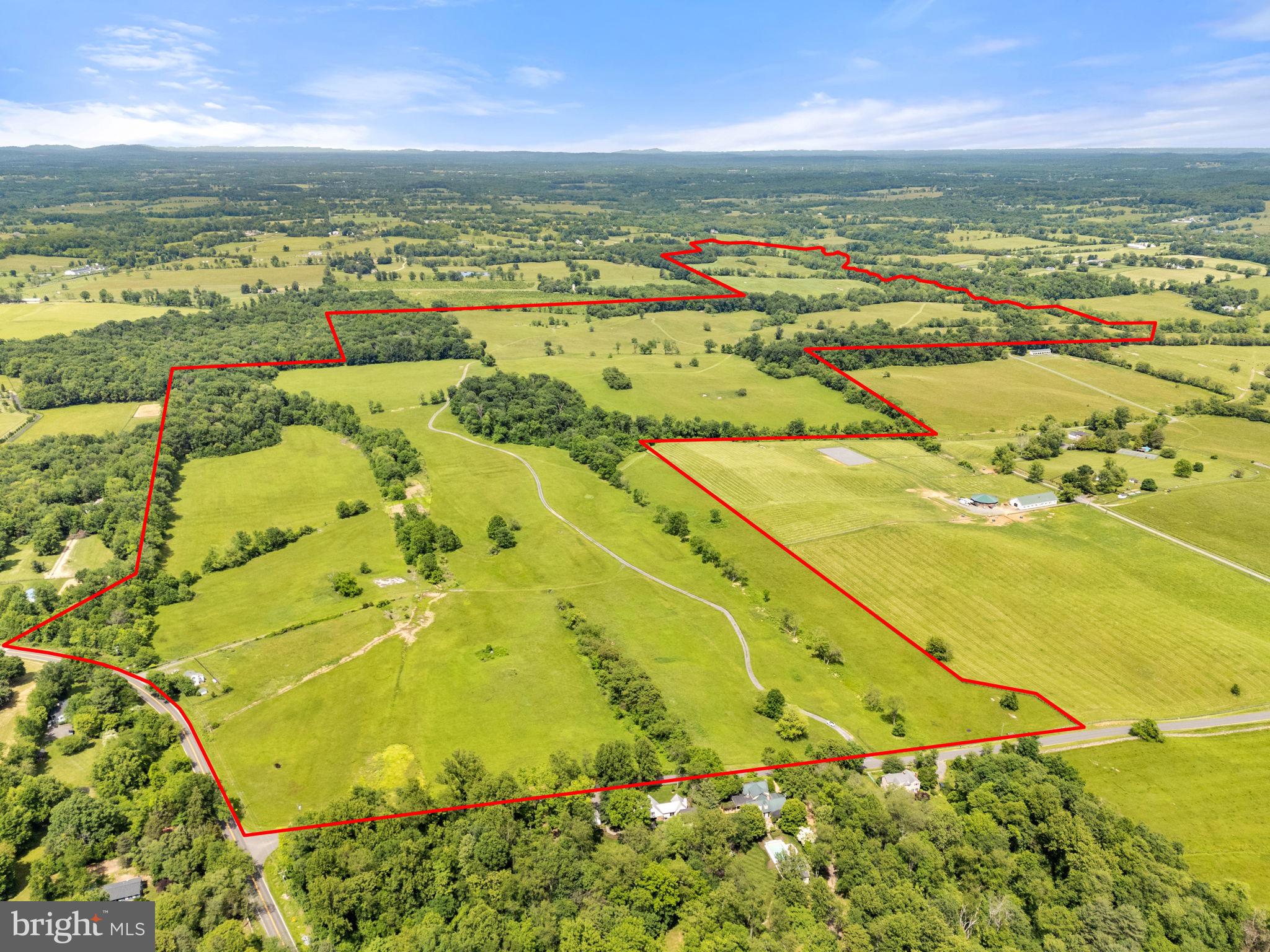 LEGACY FARM with 450 beautiful acres is mostly open and gently rolling. Beginning at the Northeast corner of the intersection of Rectortown Road and Frogtown Road, this land shares a property line with Chilly Bleak Farm. The land continues through fields, many of which have been kept in hay, all the way to Five Points Road, and has frontage on  Rectortown Road, Frogtown Road, and Five Points Road. This is prime Orange County Hunt Territory and has an Easement with Orange County Hunt Club, Inc. There is an additional easement with the Virginia Outdoors Foundation (VOF) designed to protect the beauty of this land as well as protect the viewsheds of this property and neighboring properties. There are three tax parcels; however, the easement does not allow the Property to be divided or subdivided in any manner. Boundary line adjustments might be allowed if certain conditions are met, (Refer to Easement)
There is an existing house on Rectortown Road, which is referred to in the easement as a secondary dwelling nonconforming. 
The Easement can be found in the Documents Section, a short summary is below, but do not rely on the summary, read the entire easement.
All buildings to be clustered within one-35 acre "Farmstead Area" to be created with 1 of 2 approximately 50 acre Building Envelopes "A" and "B" on the sketch plat dated April 7, 2006.