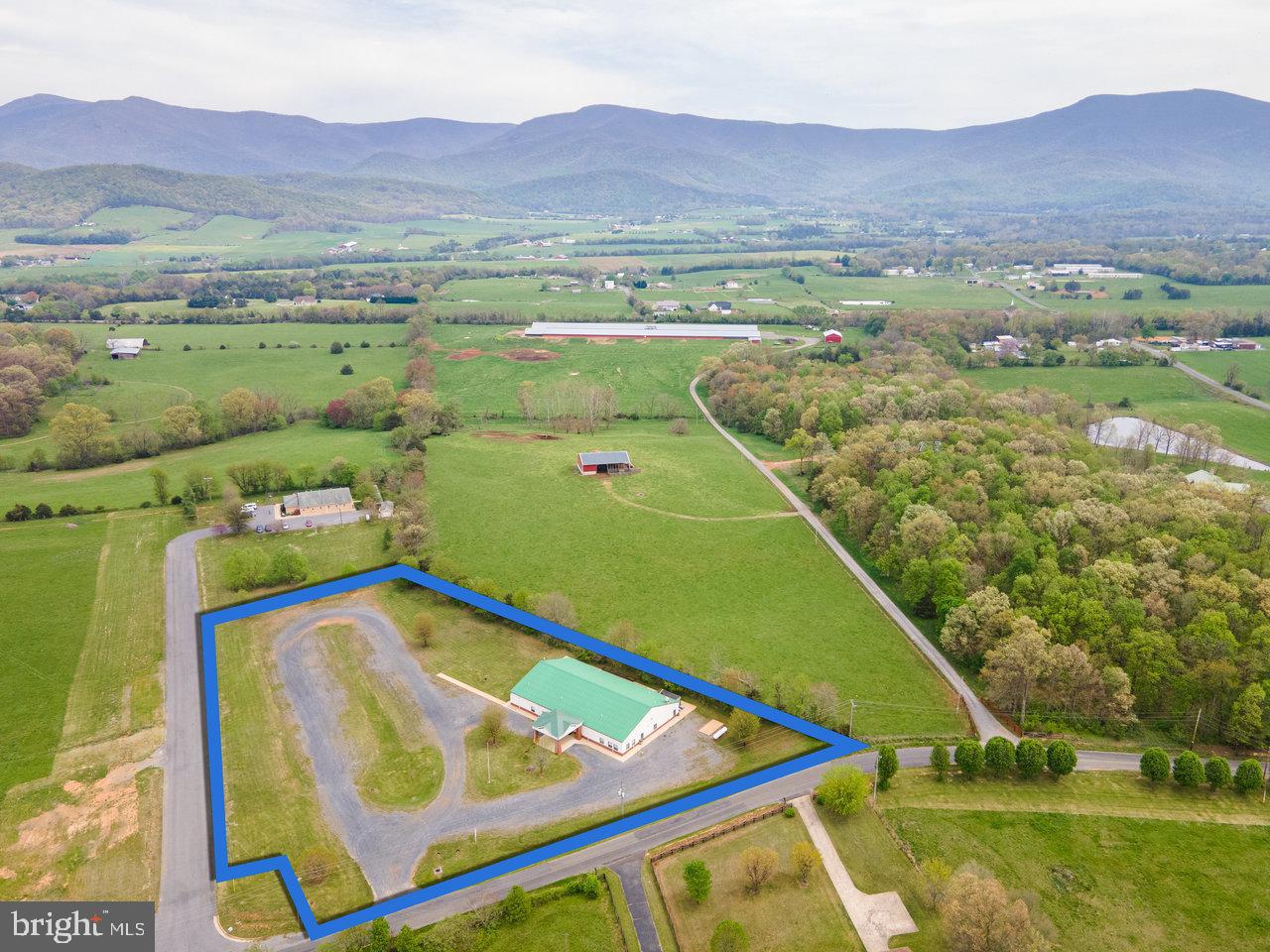 Welcome to an incredible opportunity with this over 8,000 square feet commercial building.  Currently being utilized as a turn-key wedding and event venue, this property is beautifully situated in the heart of the Shenandoah Valley. Known locally as the Goodrich Center, the possibilities for this property are nearly limitless. A welcoming foyer opens to a banquet hall, which can be divided or opened further into a grandeur space. Separate existing office and planning spaces allow for easy organization and convenience. The commercial kitchen with endless preparation space and comes with walk-in refrigeration / a deep freezer making it the perfect kitchen for hosting large events. This property is offered with all the equipment needed for hosting / catering, including tables, chairs, decorations, and linens. The property contains 2.5 acres and is conveniently located between Luray and Stanley, Virginia. A short drive will take you to the Shenandoah National Park, George Washington National Forest, Shenandoah River, and Luray Caverns. If you have a passion for owning and operating a wedding or special event business in a vibrant market area known as the one of the top wedding destinations in the state, and where all the heavy lifting has already been done, schedule an appointment today!