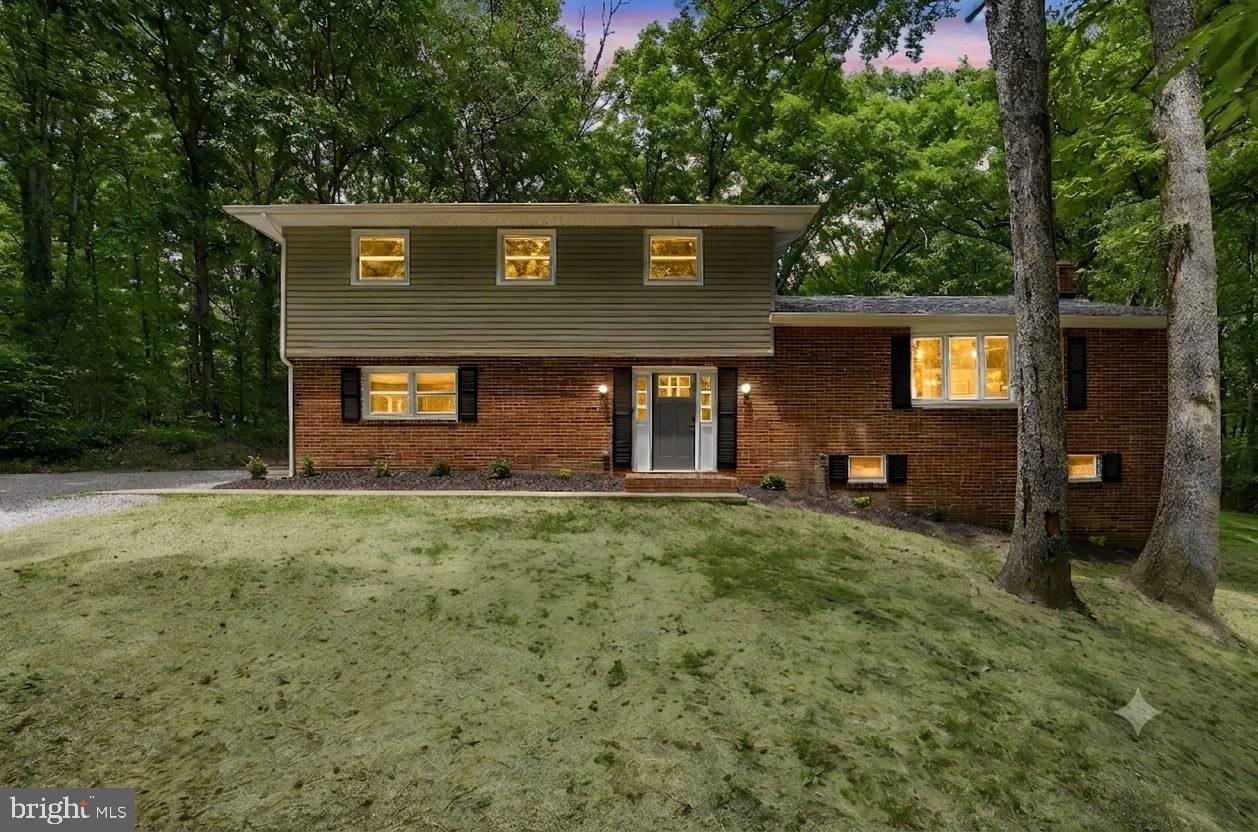 Discover peaceful living in this beautifully renovated 5 bedroom, 3 bathroom, 2,672 square feet single family home nestled on over 4 serene wooded acres! This stunning home features high end finishes and modern upgrades throughout. Step inside to a grand entryway featuring brand new luxury vinyl plank flooring and fresh two tone paint, creating a bright and contemporary feel. The entry flows into a spacious living room that opens to the dining area and kitchen. Just off the kitchen, is a gorgeous breakfast nook, featuring a fireplace and a wet bar with a new wine cooler! The fully remodeled kitchen is truly a showstopper, featuring soft close cabinetry, elegant quartz countertops, a modern tile backsplash, and sleek brand new stainless steel appliances. The main level also includes a large bedroom with beautiful views and direct access to the yard, along with a fully renovated bathroom. Upstairs, you’ll find three spacious bedrooms along with an expansive master suite featuring multiple large closets with ample storage space. All bedrooms have new vinyl plank flooring, fresh paint, and updated light fixtures. Two fully renovated bathrooms complete the upper level, showcasing stylish vanities, tiled surrounds, modern fixtures, and updated finishes throughout. The basement provides additional storage space and includes a brand new washer and dryer. Recent upgrades include a new roof, new gutters, new furnace, new AC condenser, new water heater, new thermostats, and new smoke and carbon monoxide detectors. Enjoy the privacy of a quiet neighborhood while still being conveniently located near shopping, dining, entertainment, and everyday essentials. Within approximately 7 miles, you’ll find major retailers and conveniences including Publix Super Market, Target, Planet Fitness, Kohl's, PetSmart, Marshalls, as well as numerous restaurants and other conveniences. Spotsylvania Regional Medical Center is also nearby. An added bonus - NO HOA! This exceptional property offers the perfect blend of comfort, style, privacy, and convenience. Schedule your private tour today and experience everything this beautiful home has to offer!
