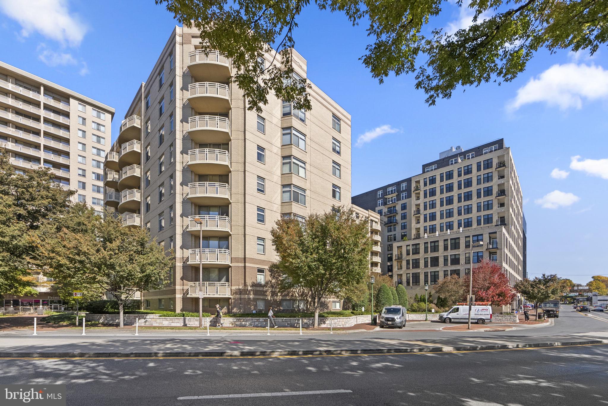 New Price! Located in the heart of Bethesda with unbeatable walkability and sought-after amenities, this beautifully updated 1-bedroom, 1-bath condo offers the perfect blend of urban convenience and everyday comfort. Enjoy the ease of assigned garage parking, a fully equipped fitness center, and a recently renovated lobby—all set within a peaceful, park-like community. Inside, thoughtful updates and spacious design make it just as impressive as its location. Soaring 8.5-foot ceilings enhance the sense of space as you step into the open-concept layout, where the kitchen, dining, and living areas flow seamlessly together. The kitchen boasts stainless steel appliances, granite countertops, sleek blue cabinetry, and a breakfast bar for casual dining. Adjacent dining and living spaces create an inviting area for relaxing or entertaining. The generously sized bedroom features a walk-in closet with built-in shelving and direct access to the full bath, which is also accessible from the main living area—ideal for guests. Enjoy the convenience of an in-unit washer and dryer. Recent updates in 2024 include luxury vinyl flooring, fresh paint throughout, modern light fixtures, new blinds, and a new microwave. Building amenities include a fitness center, updated lobby, and assigned garage parking with a personal bike rack. Located just steps from Bethesda Row, the Capital Crescent Trail, Trader Joe’s, Giant, Target, the Farm Women’s Market, parks, NIH, Walter Reed, and the Metro, this home offers the best of Bethesda living. Schedule a showing today!