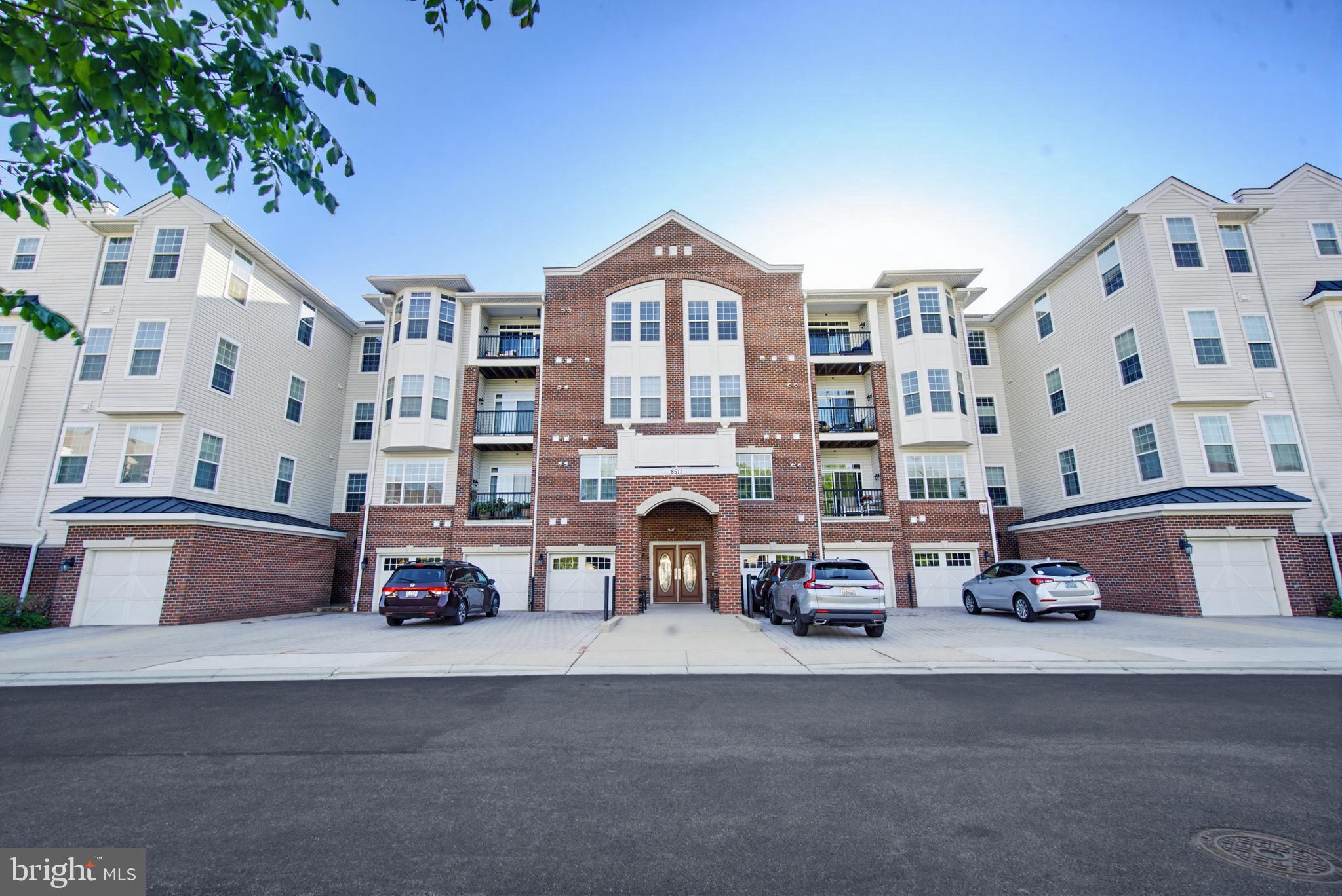 Welcome to 8511 Coltrane Court, Unit 204 — a sunny, beautifully updated 2 bedroom, 2 full bathroom condo in the highly sought-after Gatherings at Ellicott Mills 55+ community. This move-in-ready home combines modern comfort with timeless design. Enter into a bright and open layout, where an abundance of natural light fills every room. The home has been updated with brand new waterproof luxury vinyl plank throughout, creating a warm and inviting atmosphere. The beautifully upgraded gourmet kitchen features stainless steel appliances, tile backsplash, and granite countertops. Just off the kitchen, a functional dining room provides the ideal space for meals and gatherings. Retreat to the spacious, sun-filled primary bedroom suite, complete with a large walk-in closet, a second closet for additional storage, and a beautifully appointed en-suite bathroom featuring dual sinks, a roman shower, and a linen closet — your own private spa-like escape. A well-sized second bedroom and an additional full bathroom provide plenty of space for guests, family, or a home office. Step out onto your private balcony and take in the peaceful views. To top it all off, enjoy the convenience of in-unit laundry and direct building interior access to your private enclosed garage — keeping you comfortable and dry year-round. Beyond the unit itself, this amenity-filled community truly has it all. Arrive home each day through a spacious and welcoming lobby, and take advantage of the elevator building for easy access. Enjoy the clubhouse, outdoor pool, fitness center, game room, and beautifully landscaped grounds — everything you need is right at home. Conveniently located near shopping, dining, and entertainment including Walmart, H Mart, Home Depot, and more — all just minutes away. Experience low-maintenance, resort-style living in one of Ellicott City's most desirable active-adult communities. Don't miss the opportunity to make this yours!