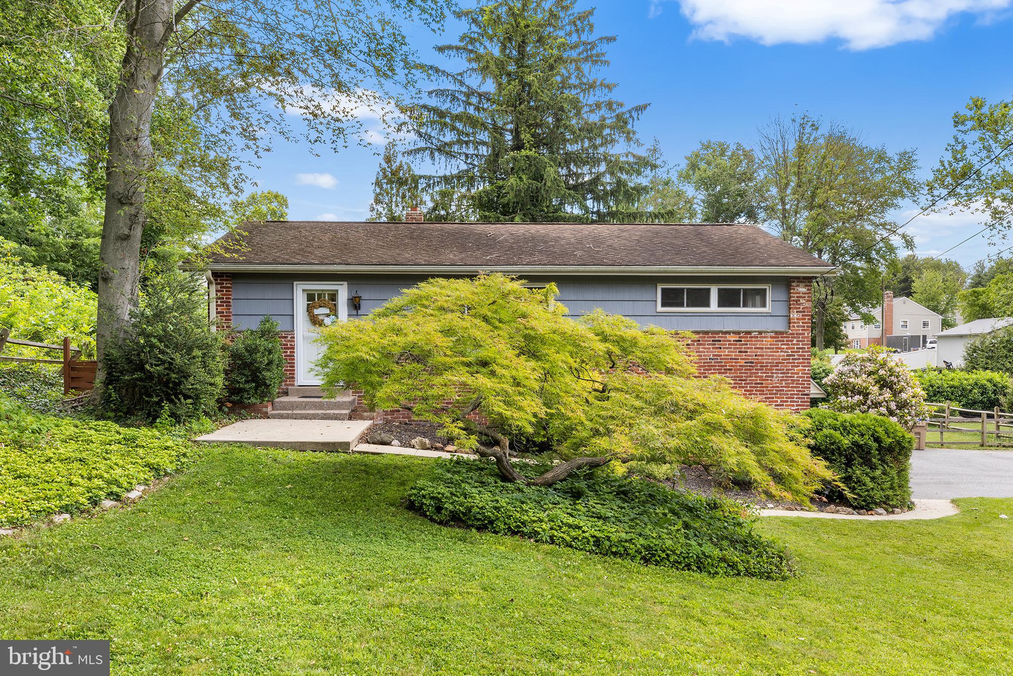 Nestled in the charming Newtown Heights neighborhood, just steps from the Ellis Preserve shopping area and all that it has to offer, this charming ranch-style home offers a perfect blend of comfort, convenience and easy everyday living. With its timeless stucco exterior and beautiful landscaping, this home has great curb appeal. Step inside to discover a warm and welcoming interior, where hardwood floors flow seamlessly throughout most of the main floor, and new interior doors aare a nice upgrade to the home. The combination dining and living area is bathed in natural light, making it an ideal spot for gatherings or quiet evenings at home. The spacious and functional kitchen is equipped with high-end stainless appliances, including new electric oven/range, refrigerator, and Bosch dishwasher ensuring that culinary enthusiasts will feel right at home. The thoughtful layout provides ample counter space, making meal preparation a joy. This residence boasts three bedrooms, all with hardwood floors, and a newly renovated, nicely tiled hall bath featuring a tub shower that invites you to unwind after a long day. The finished daylite basement has nice views of the rear yard from the large window, adds valuable living space, perfect for a home office, media room, or play area, catering to your lifestyle needs. The convenient half bath and laundry room with large storage area complete this level. Located off the kitchen is the private patio area, where you can enjoy al fresco dining or simply bask in the tranquility of your surroundings. The expansive fenced lot, spanning 0.3 acres, provides plenty of outdoor space for gardening or leisure activities and is also great for pets! Another convenient feature is the attached garage with extra storage space, ensuring that your belongings are neatly organized. Improvements by the current owner are a new EV charger, new interior doors, renovated full bath, new electric hot water heater, new kitchen appliances, new garbage disposal and a new luxury vinyl plank floor in the lower level.  This home is located in a great neighborhood that offers privacy and a great sense of community, yet it is just minutes to Ellis Preserve with its great restaurants, shopping, and Whole Foods.   Experience the perfect blend of neighborhood, convenience and easy living in this charming Newtown Heights residence. Embrace the opportunity to make this house your home, where every detail has been thoughtfully curated for your enjoyment.