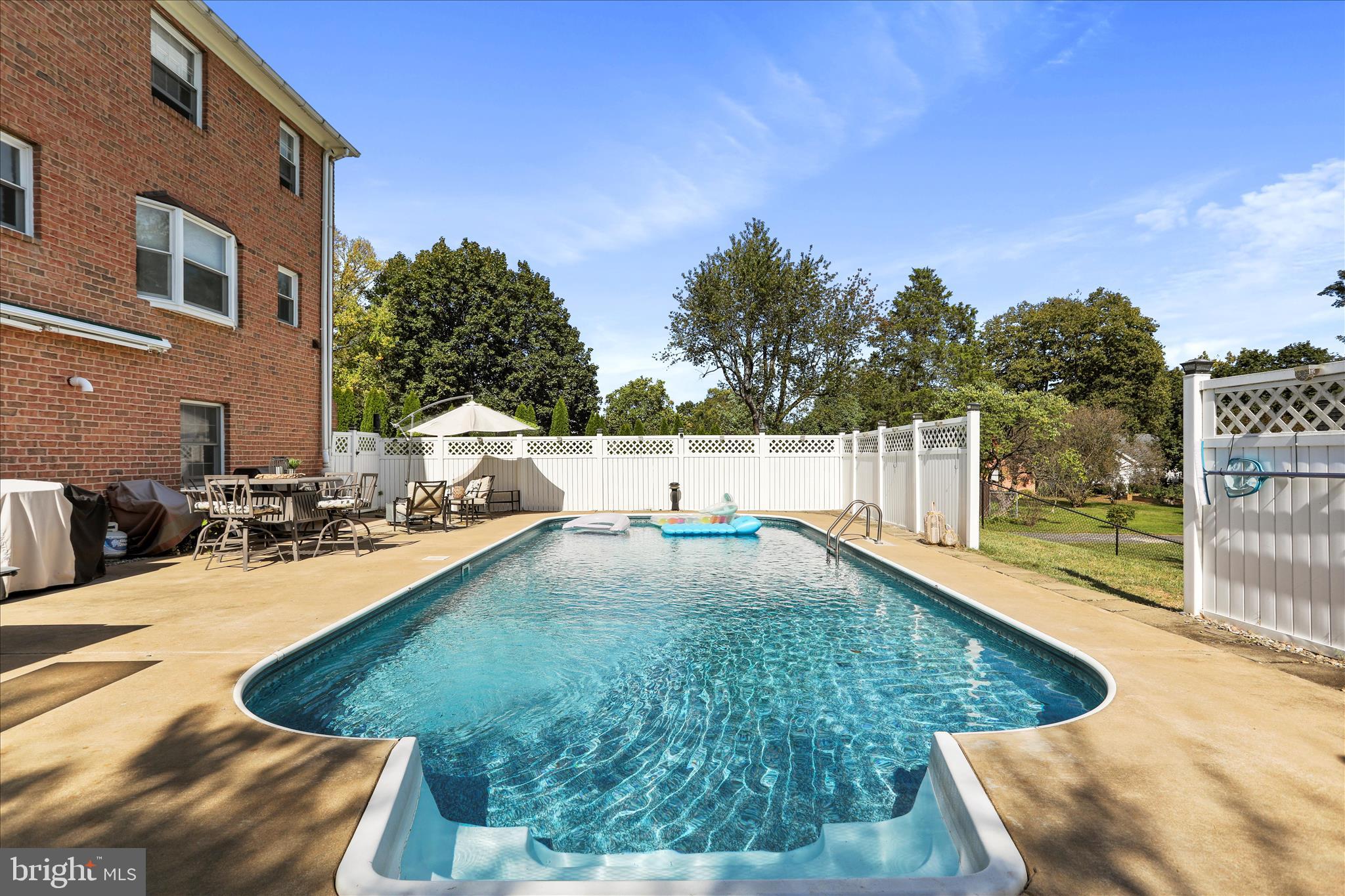 Welcome to 305 North Red Hill Road, a timeless all-brick colonial nestled in one of Martinsburg’s most sought-after neighborhoods. Offering over 3,700 square feet of living space, this beautifully maintained 5-bedroom, 3.5-bath home combines classic charm, generous room sizes, and modern updates in a setting designed for both everyday living and memorable entertaining.
Step inside to discover spacious living and dining areas, abundant natural light, and a floor plan that offers flexibility for growing families, remote work, or multi-generational living. The updated roof provides peace of mind, while the home’s solid brick construction reflects quality craftsmanship built to stand the test of time.
Outdoors, your private backyard retreat awaits. Spend summer days relaxing by the in-ground pool, hosting gatherings on the patio, or enjoying the mature landscaping that creates a sense of privacy rarely found in town. The detached garage offers additional storage, workshop space, or room for recreational vehicles and hobbies
Located in the desirable Rosemont area, this property offers convenient access to shopping, dining, schools, medical facilities, and major commuter routes while maintaining the character and charm of an established neighborhood.
Whether you’re entertaining poolside, gathering with family for the holidays, or simply enjoying a quiet evening at home, 305 North Red Hill Road offers the space, comfort, and lifestyle you’ve been searching for.
Schedule your private showing today and experience everything this exceptional property has to offer.