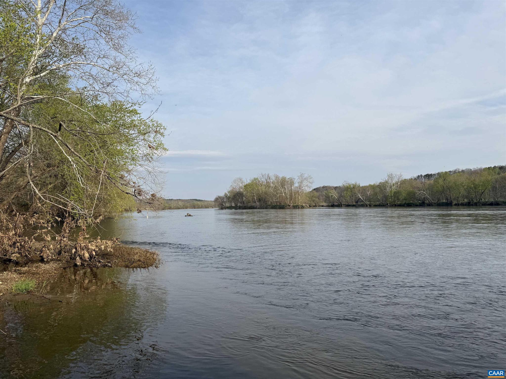 Located just 30 minutes outside of Charlottesville. This James River Farm is 118 acres of open ground and mature hardwood timber fronting the James River just downstream from Scottsville.   The property offers elevated building sites overlooking the river, along with Little Georgia creek that makes up the South and Eastern property lines. Wildlife is evident throughout with turkey, deer and ducks being seen all over the property in just the past few weeks.   Approximately 35 acres are in open low ground along with 1,500 feet of river frontage, giving you usable land for farming, recreation, or the potential to create a strong waterfowl habitat and hunting situation. There is a nice gravel road that starts at the entrance of the property and leads down to the low grounds making easy access the river.    This stretch of the James River is well known for smallmouth bass fishing, and the access to the water is gentle and easy?whether you?re walking down or putting a boat in. The property has road frontage on Paynes Pond Road, along with a second gated access off the same road.   Large acreage on the James River is hard to find, especially this close to Charlottesville. Whether you?re looking for a place to build, hunt, or fish this is
