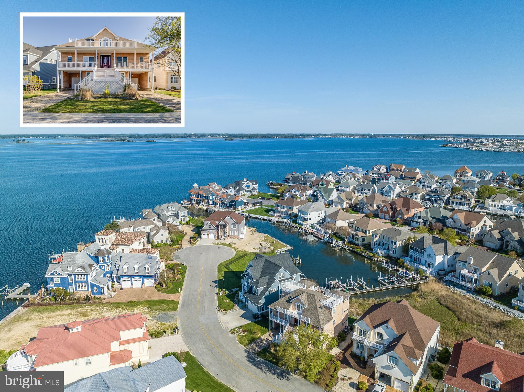 Nestled within the prestigious Heron Gull Community of Ocean City, Maryland, this waterfront oasis epitomizes coastal luxury living. Boasting direct access to the tranquil bay, this property offers a lifestyle of serenity and relaxation. Ascending three levels, each adorned with spacious decks and breathtaking water views, this residence features six bedrooms and 5.5 baths, providing ample space for both family and guests. With primary suites located on both the main and upper levels, residents are treated to unparalleled comfort and convenience. The heart of the home is found within the great room, where soaring ceilings accentuate the sense of space and grandeur. Flooded with natural light streaming through multiple sliding glass doors and windows, this inviting space seamlessly merges indoor and outdoor living. A chef's dream, the gourmet kitchen is appointed with granite countertops, a sizable island, and stainless-steel appliances, including a Viking gas range. Adjacent, the spacious dining room offers panoramic views of the bay, while a screened porch provides an idyllic setting for al fresco dining and entertaining. Retreat to the main level primary suite, where balcony access beckons you to unwind while soaking in picturesque sunsets. The lavish attached bath features a large jetted soaking tub, expansive shower with dual shower heads, and a gracious walk-in closet complete with built-in organizers and cabinetry. Descending to the lower level, a large family room, flex room, office, and laundry area await, providing additional space for recreation and relaxation. Embrace the coastal lifestyle just steps from the bay, where boating enthusiasts will appreciate the convenience of a private boat slip right out the back door. Whether enjoying water activities or simply soaking in the tranquil surroundings, this waterfront retreat offers an unparalleled opportunity to savor the best of coastal living in Ocean City, Maryland.