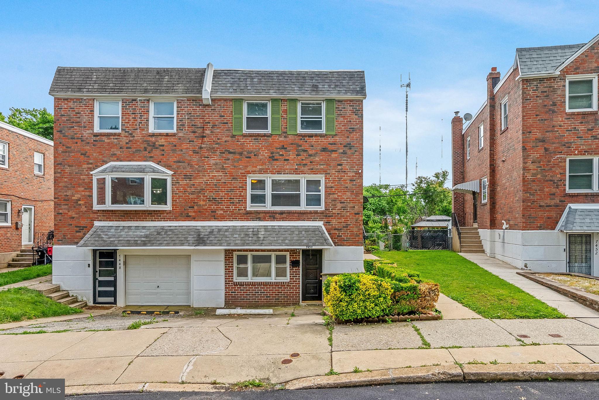 Offering a suburban setting, endless potential, and abundant space inside and out, 7450 Hill Road is a hidden gem in a prime Roxborough location! This semi-detached home offers 4 bedrooms, 2.5 bathrooms, a huge finished basement, a 1-car driveway, central a/c, and a sprawling gated yard. A quiet, low-traffic block leads to the classic brick facade. Inside, the bright and airy main level features an oversized living room with expansive windows, a formal dining room and a convenient powder room at the center, and a sunlit eat-in kitchen at the front. Upstairs, the large primary suite has an attached bathroom, while three more bright, spacious bedrooms and a second full bathroom are down the hall. Down in the finished basement, there are two huge separate spaces along with storage and a private entrance, making it ideal for a future in-law suite, media room, or gym. Out back, the grassy yard offers tons of room for entertaining, gardening, pets, or creating an incredible outdoor oasis. In addition to everything inside, this location is close to shops and restaurants along Ridge Ave, including Target and ShopRite, plus there’s easy access to lively Main St in Manayunk, Chestnut Hill, Conshohocken, and I-76. Schedule your showing today! Some photos have been AI enhanced.