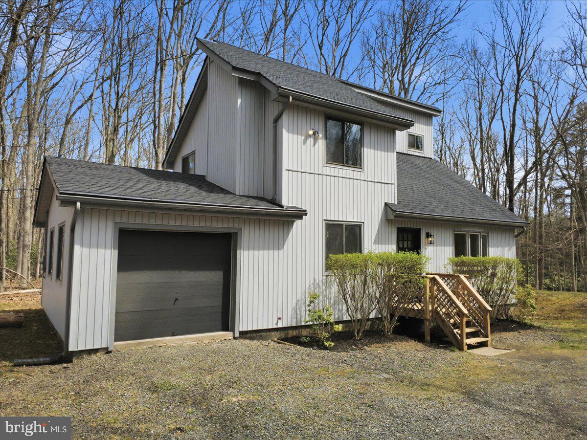 Welcome to 186 Timberlane Dr in the Holiday Pocono Civic Association gated community which offers a clubhouse, 2 lakes, a beach and private shooting range. This beautiful 4 bedroom 2 full bath mountain home has been fully renovated with top notch materials and finishes. The pride of professional craftsmanship can been seen throughout the home! This is the one you have been waiting for, schedule your tour today!