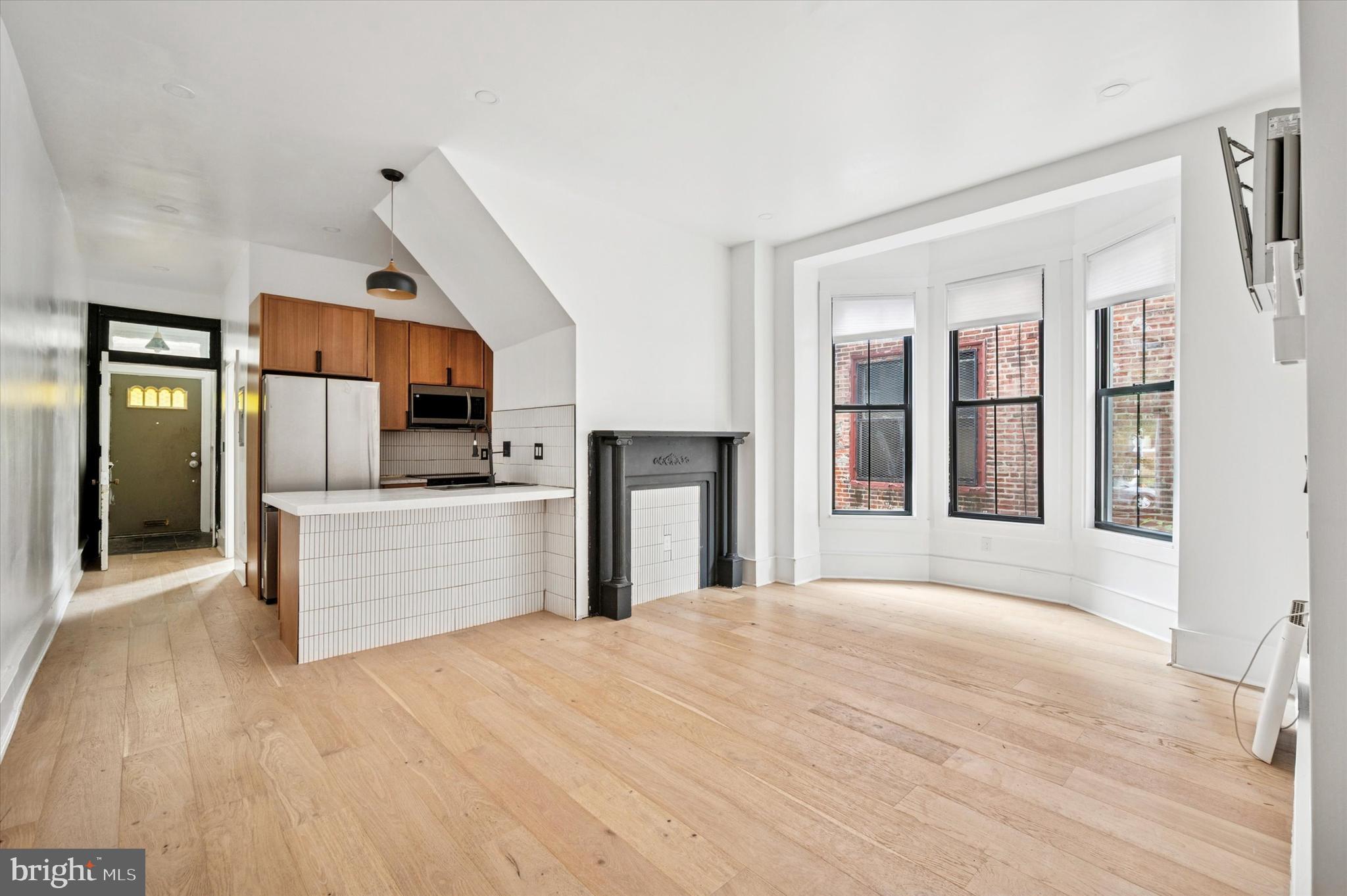 Here’s a great value-add opportunity to finish the renovation-in-progress of a spacious triplex in a fantastic Cedar Park location. Get your crew in and out and you’ll have three units in a high-rent, high-demand area in a matter of weeks, not months. Plenty of work has been done toward creating stylish contemporary spaces that highlight the Victorian architecture, which includes a turret and a multi-story bay window. High-quality finishes and fixtures already in place include Samsung appliances, Jeld-Wen windows, slate and penny tiles, wide-plank white oak flooring, and LG ArtCool Gallery mini-splits with Smart Inverter condensers. The first-floor unit is almost completely finished; it’s a 1bed plus den with exclusive porchfront access and direct access to the rear yard, which has a deck, raised garden beds and a new privacy fence. The second and third floor one-bedroom units share a side entrance and have quite a bit further to go, but have been mostly roughed in with some finishes in place. They will be incredible spaces thanks to each having a bedroom with a turret accent. If desired, all units can share access to the rear yard via a side gate. Being sold strictly as-is, where-is, this building is in a great pocket of West Philly with Cedar Park, Clark Park and the Kingsessing Rec Center all very close by, as well as Baltimore Ave shopping and dining and the trolley into Center City.