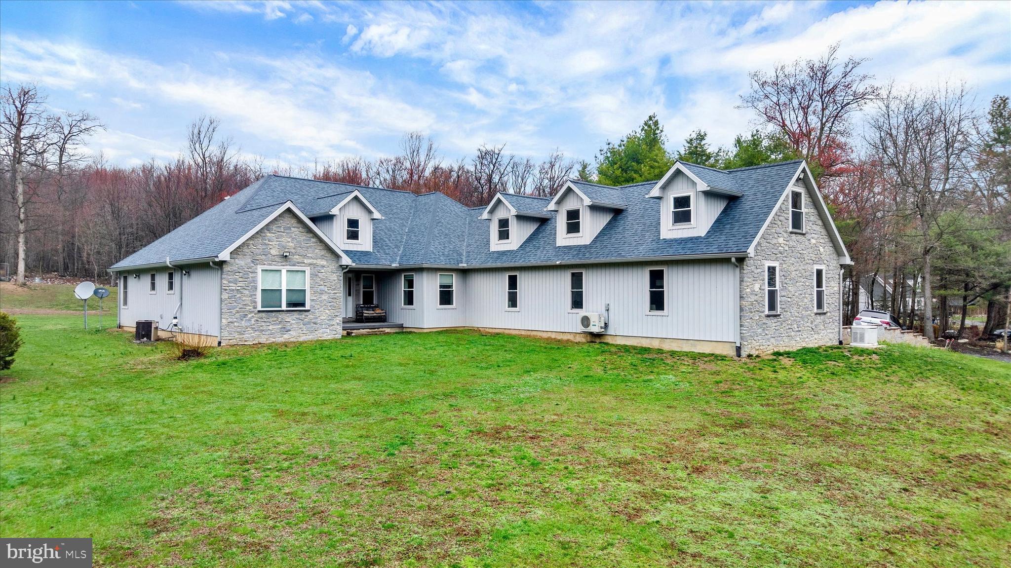 Discover the perfect blend of comfort, privacy, and outdoor lifestyle with this spacious 3,800 sq. ft. ranch/cape cod style home featuring 4 bedrooms and 3.5 bathrooms, set on just under 20 acres of beautiful countryside. Tucked away on a quiet, lightly traveled road, this property offers the peaceful setting so many buyers dream about, yet it’s just minutes from Interstate 78, providing convenient access while still feeling private and secluded.

The home has been thoughtfully updated with brand-new siding, roof, and windows, giving it fresh curb appeal and long-term peace of mind. A whole-house Generac generator provides added security and reliability, while the large three-car attached garage offers ample space for vehicles, tools, or recreational equipment.

Surrounded by generous open space around the home and enrolled in the PA Clean and Green Program, the property benefits from favorable tax treatment while helping preserve the natural character of the land.

For outdoor enthusiasts, this property truly stands out. The land itself offers excellent hunting potential, and it is just one parcel away from thousands of acres of Pennsylvania State Game Lands, giving you incredibly convenient access to public land for hunting, hiking, and exploring. It’s the perfect setup for those who want private land to enjoy while still having expansive public land opportunities just a short distance away.

Whether you're looking for a private homestead, a peaceful mountain retreat, or the ultimate basecamp for outdoor adventure, this rare property offers the space, setting, and lifestyle to match.