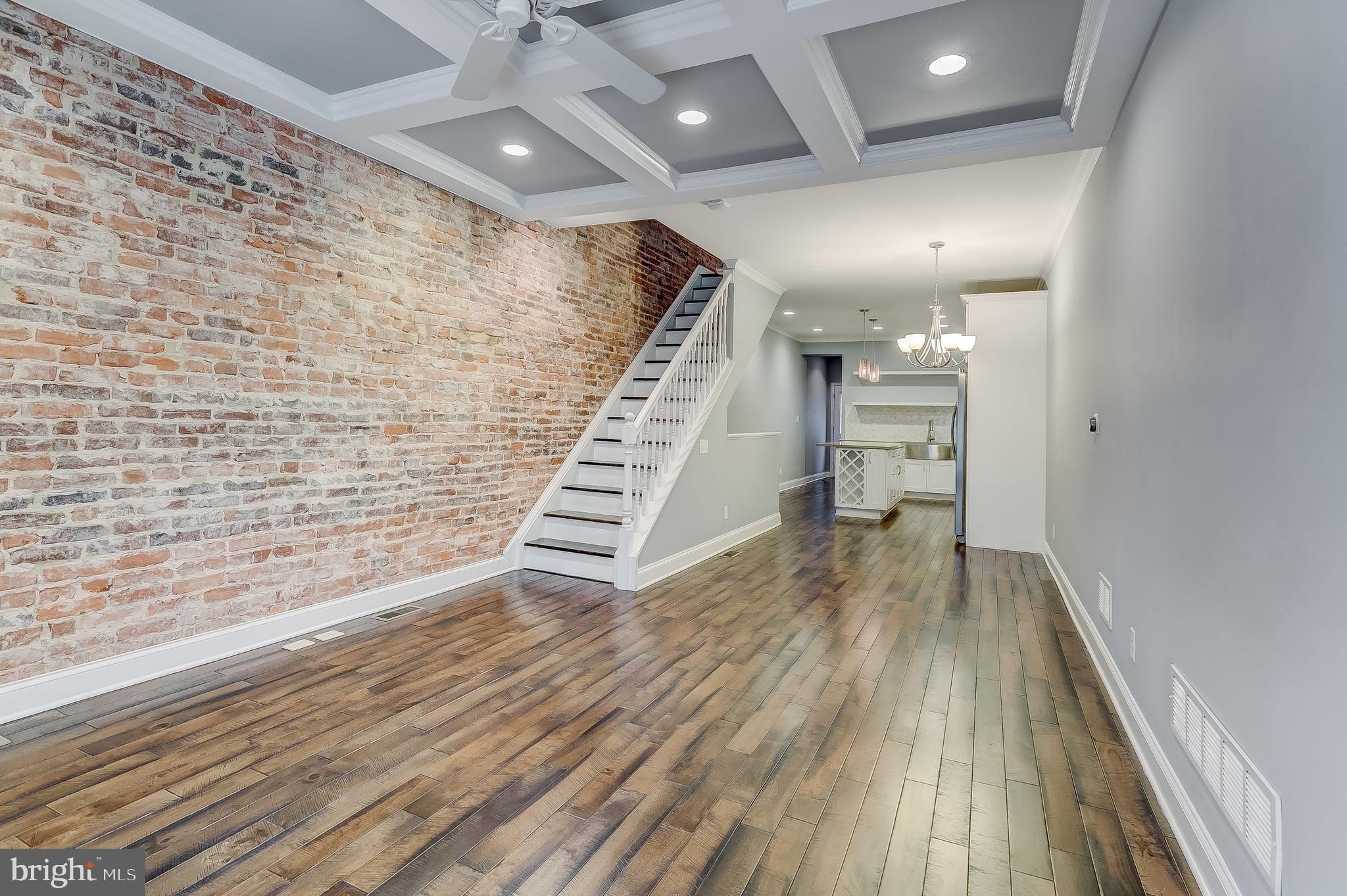 Welcome home!  Fantastic 3 BR 3.5 BA rowhome for rent.  Wood floors throughout the main level and upstairs.  Kitchen  offers quartz countertops, herringbone marble backsplash, large island, and stainless steel appliances.  Primary Bedroom offers walk in closet and in suite bathroom with double vanity and frameless glass shower.  Basement is fully finished with additional living space and 3rd bedroom with full bathroom.  Pop down access roof deck with incredible views of Patterson Park and off street parking for one car.   Schedule your showing today!