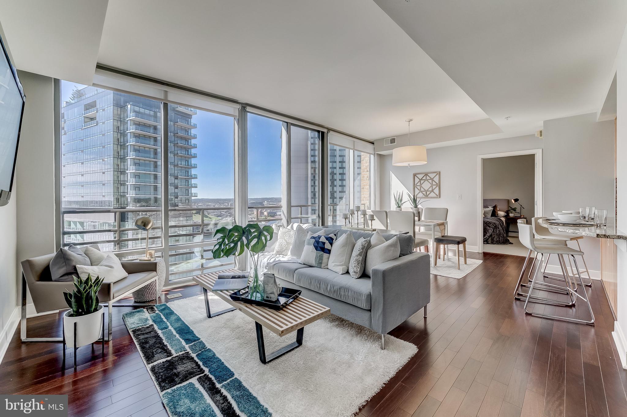 LUXURIOUS WATERFRONT CONDO IN HARBOR EAST AT 'THE VUE'. FULLY RENOVATED 2 BEDROOMS WITH 2 FULL BATHROOMS. LOADS OF NATURAL LIGHT. HIGH CEILINGS. ENJOY CUSTOM CABINETRY, IMPORTED TILE, UPGRADED TRIM PACKAGE, GRANITE COUNTERTOPS, STAINLESS STEEL APPLIANCES IN DESIGNER CHEF'S KITCHEN. INCREDIBLE EXPANSIVE WATER AND CITY VIEWS. 1 ASSIGNED GARAGE PARKING SPACE. CLOSE PROXIMITY TO LOCAL SHOPPING, RESTAURANTS, ALL MAJOR HIGHWAYS, WHOLE FOODS, CVS, GYM, THEATER, AND THE INNER HARBOR. SCHEDULE YOUR PRIVATE SHOWING TODAY! AVAILABLE FOR IMMEDIATE MOVE IN.