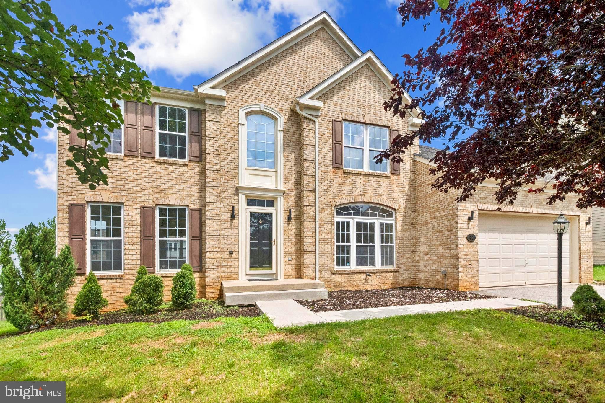 This spacious 3-story brick-front colonial has everything you’re looking for—inside and out! Upstairs, all 4 bedrooms are carpeted, including the spacious primary suite with a large sitting room/den and ample storage. The primary bath includes a soaking tub and separate glass-enclosed shower, and there's a second full bath down the hall for the other bedrooms. With 4 bedrooms, 2 full baths upstairs, an updated kitchen and LVP on the main level, there’s plenty of space for comfortable everyday living.  

The main level features a light-filled open layout with fresh paint, new floors, and a stunning kitchen that’s been completely redone with white shaker cabinets, quartz counters, stainless steel appliances, and a sleek center island and dining room off the kitchen.  The family room on the main level is bright and welcoming, with cozy carpet and a fireplace as the centerpiece. Downstairs, the walk-out basement is unfinished and ready for your personal touch.  A 2-car attached garage and, 2-car driveway make parking and storage easy. 

A large open backyard awaits your personal touch, this home blends upscale living with everyday ease. Come see it for yourself!